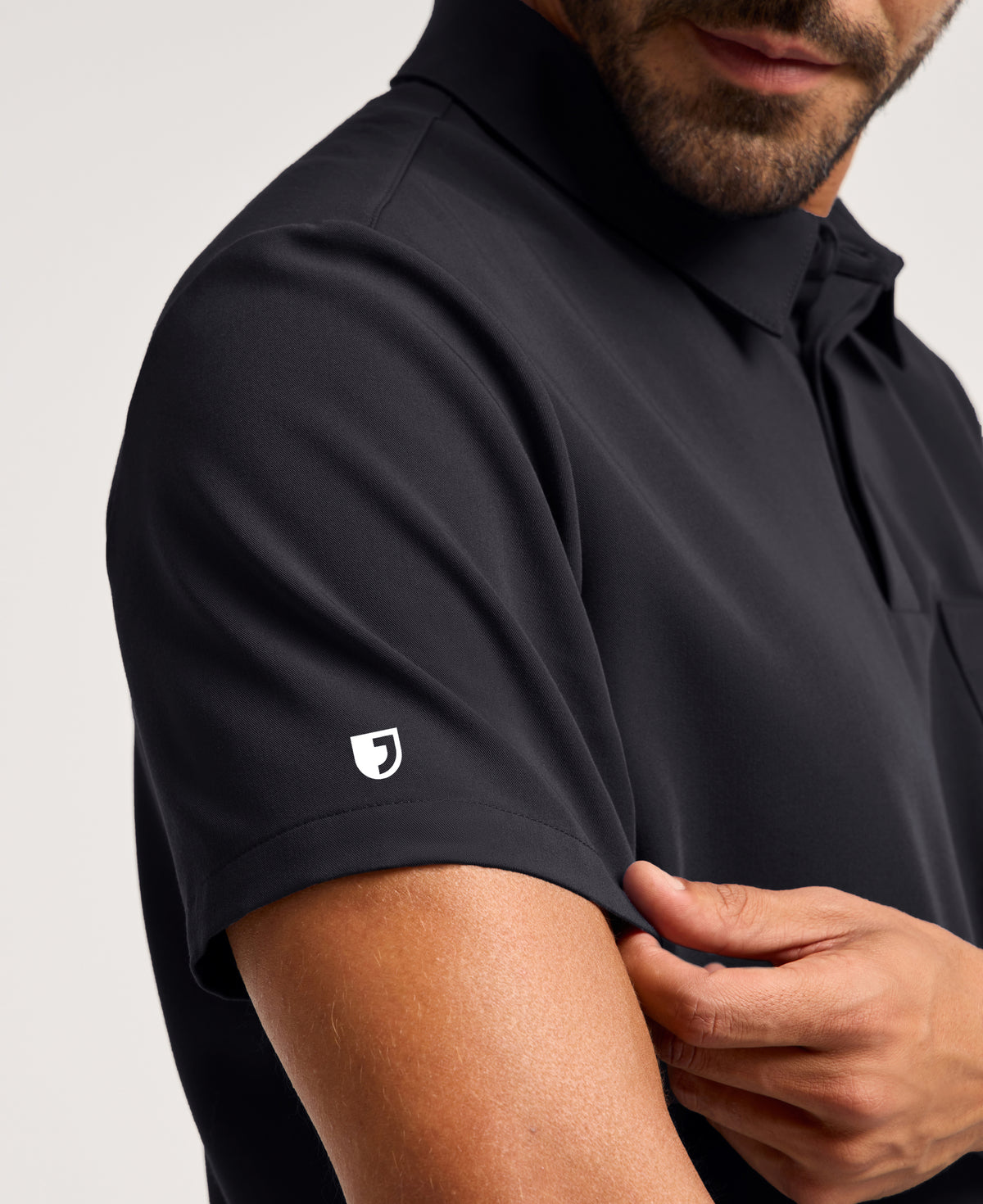 Jaanuu Calderon Polo Scrub Top in Black, product photo 6 of 6
