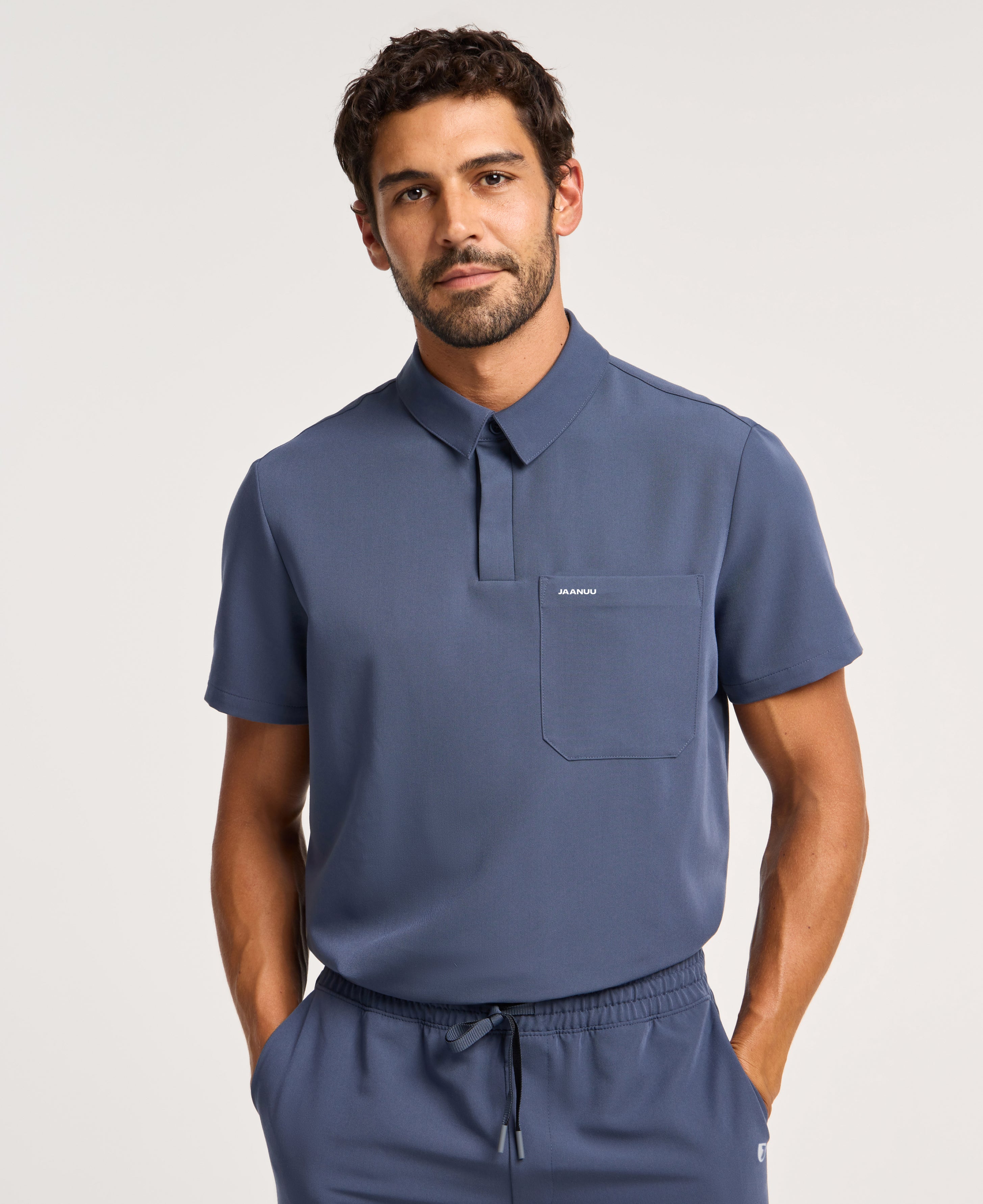 Jaanuu Calderon Polo Scrub Top in Carbon Gray, product photo 1 of 6