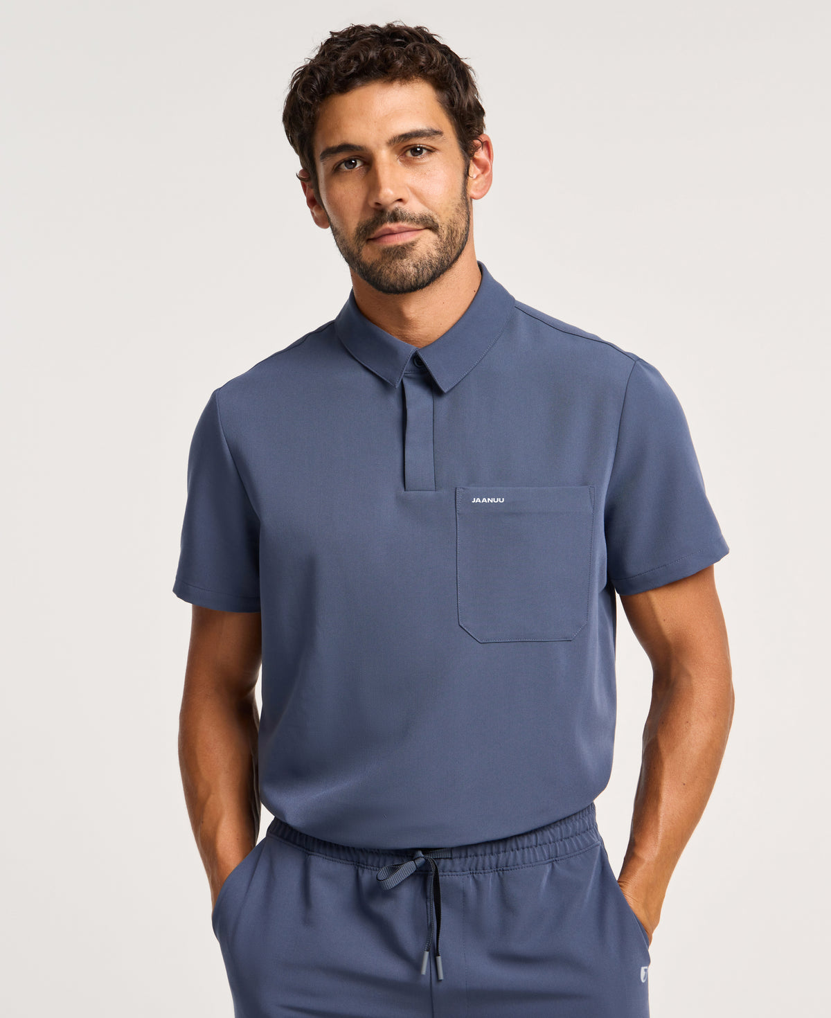 Jaanuu Calderon Polo Scrub Top in Carbon Gray, product photo 1 of 6