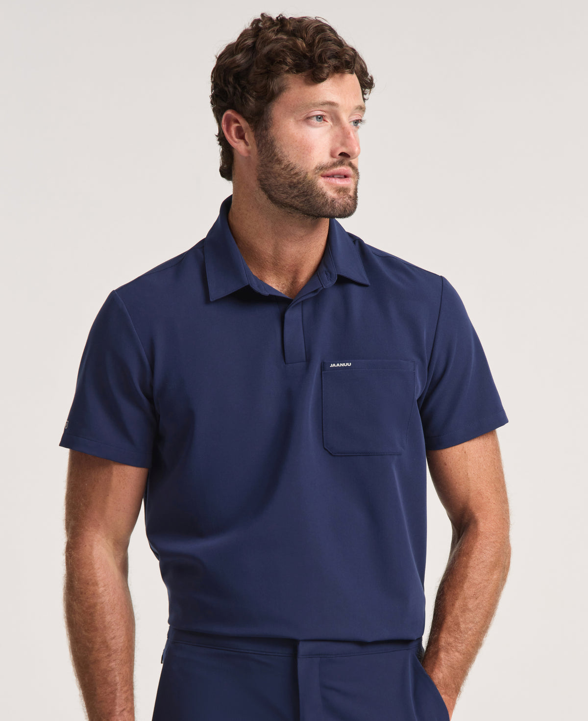 Jaanuu Calderon Polo Scrub Top in Midnight Navy, product photo 1 of 6