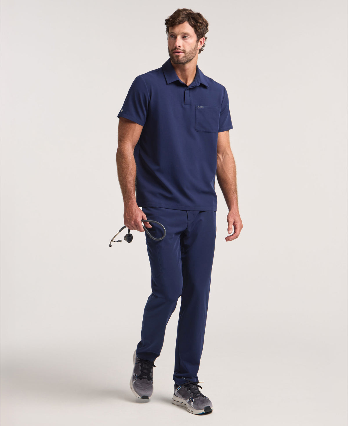 Jaanuu Calderon Polo Scrub Top in Midnight Navy, product photo 2 of 6