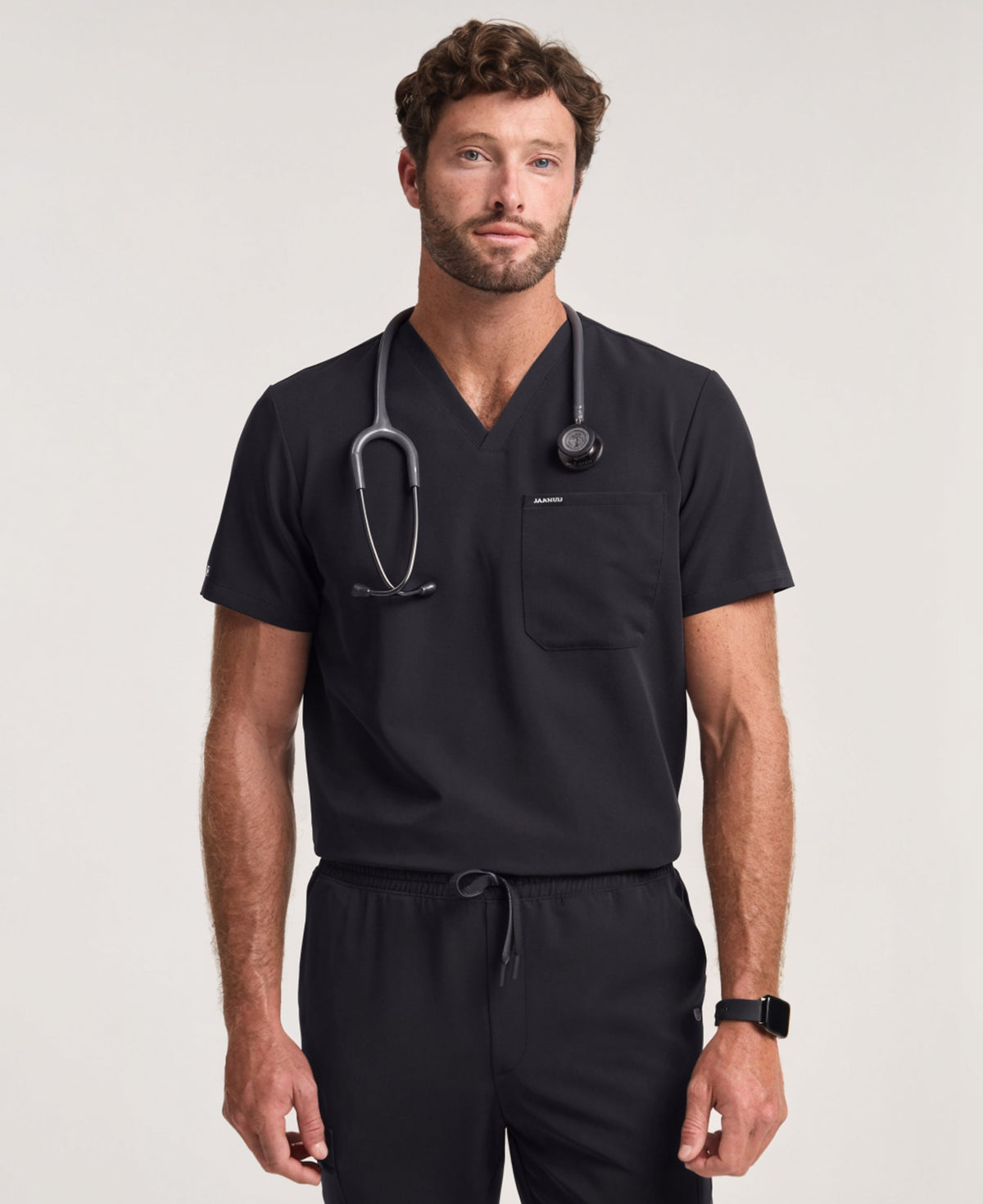 Jaanuu Holmes Slim 1-Pocket Scrub Top in Black, product photo 1 of 6