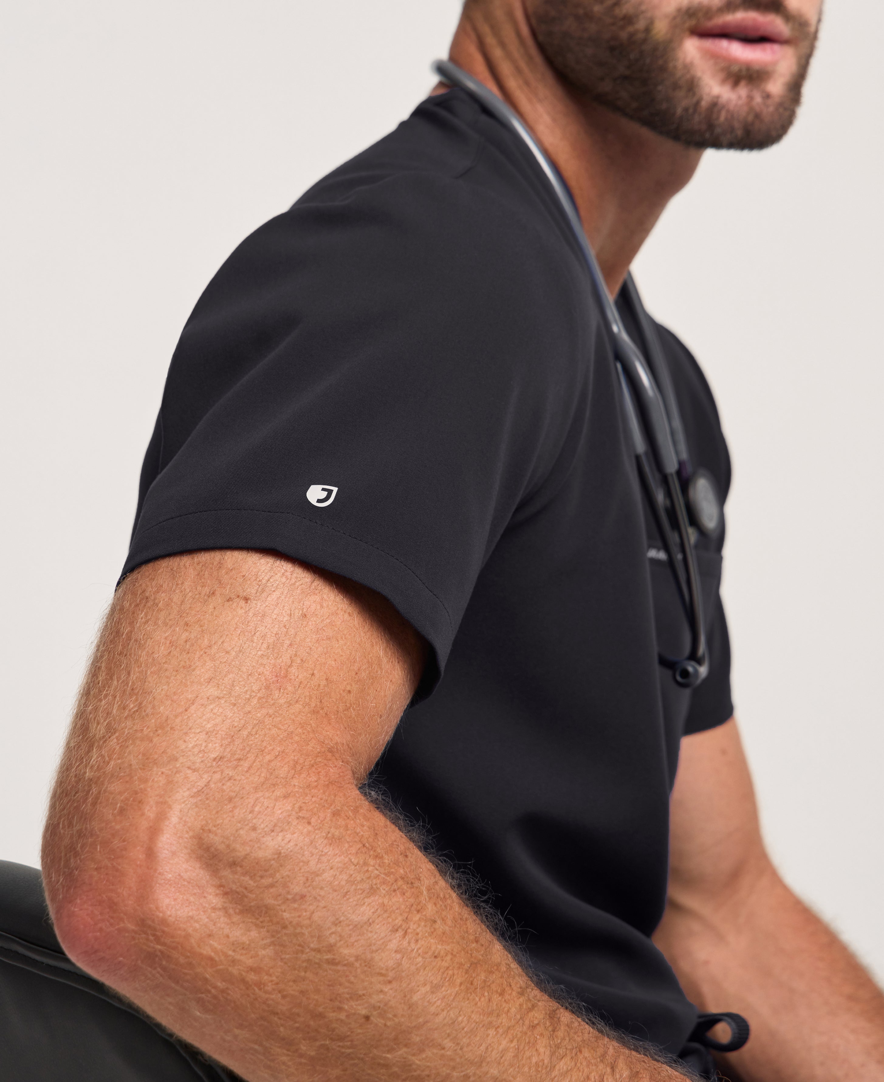 Jaanuu Holmes Slim 1-Pocket Scrub Top in Black, product photo 4 of 6