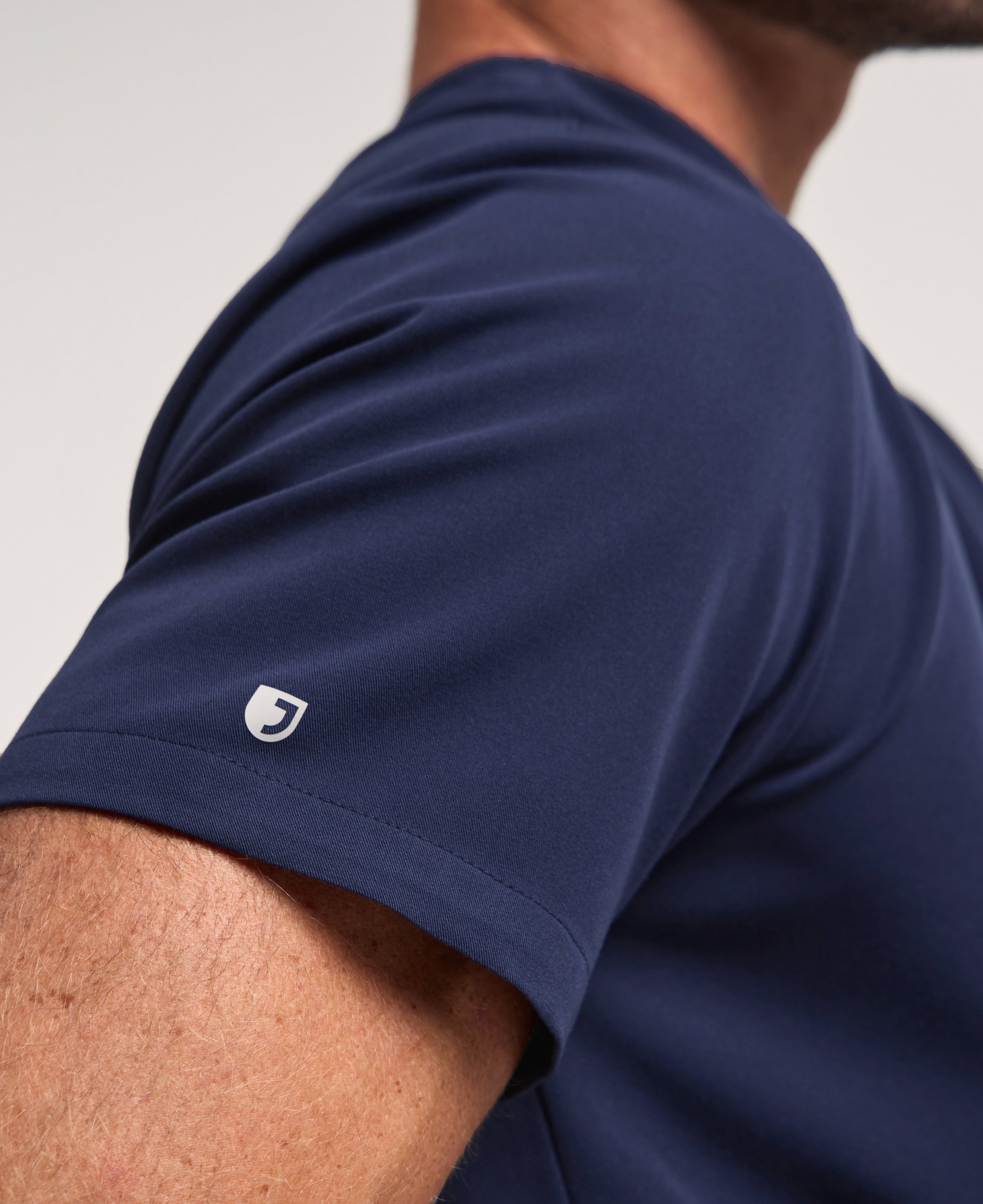 Jaanuu Holmes Slim 1-Pocket Scrub Top in Midnight Navy, product photo 4 of 6