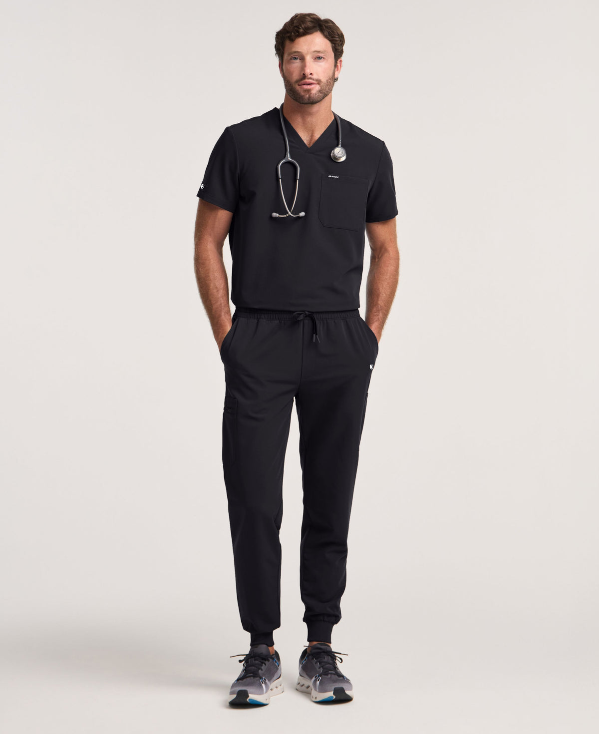 Jaanuu Osmo 8-Pocket Scrub Jogger in Black, product photo 1 of 6