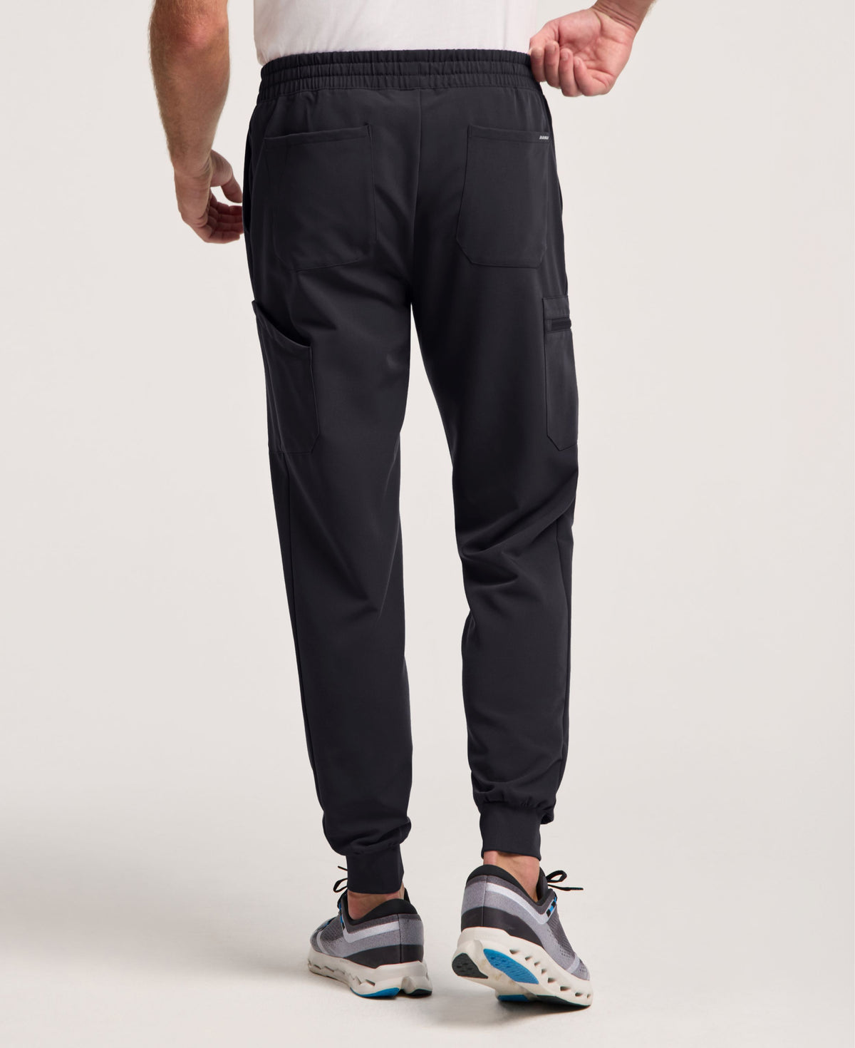 Jaanuu Osmo 8-Pocket Scrub Jogger in Black, product photo 4 of 6
