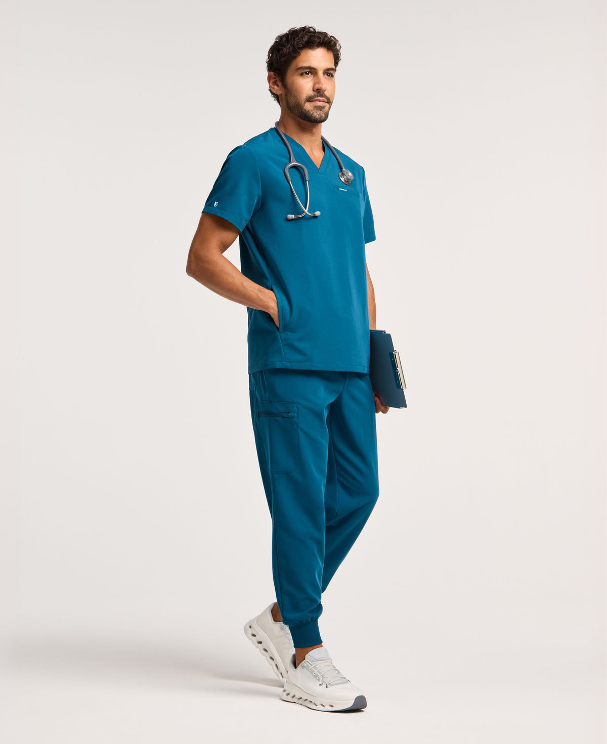 Jaanuu Osmo 8-Pocket Scrub Jogger in Caribbean Blue, product photo 1 of 6