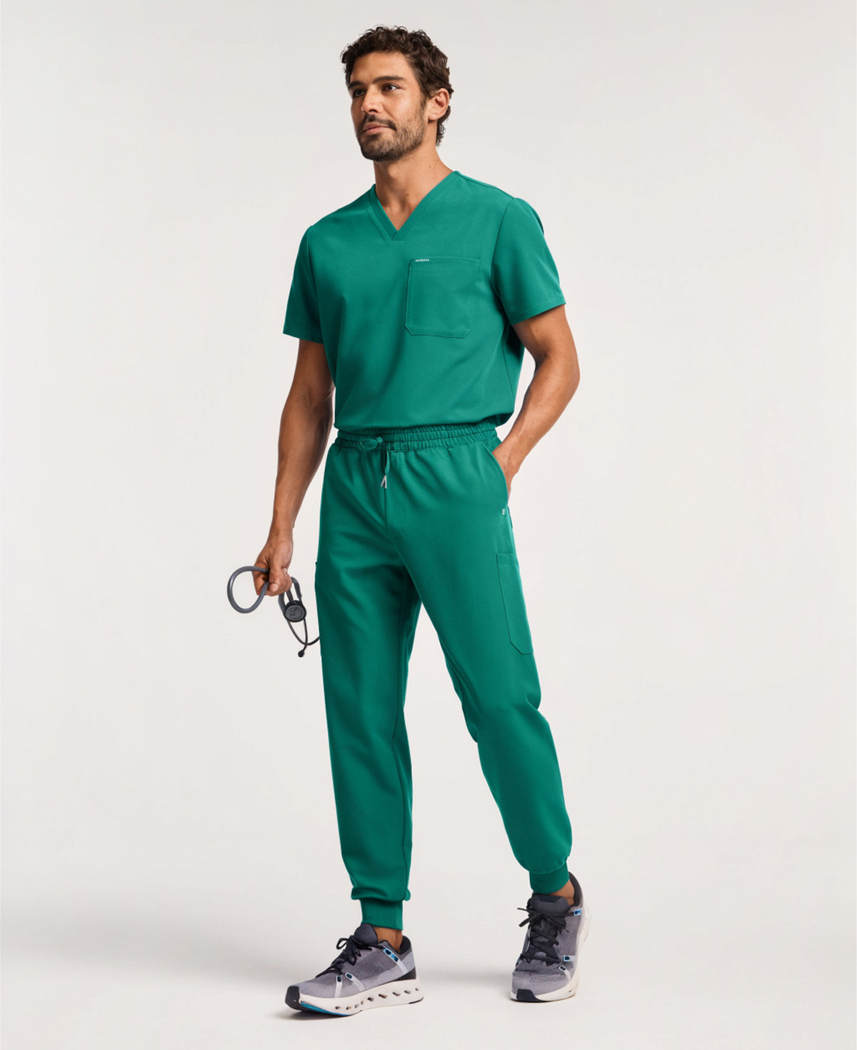 Jaanuu Osmo 8-Pocket Scrub Jogger in Hunter Green, product photo 2 of 6