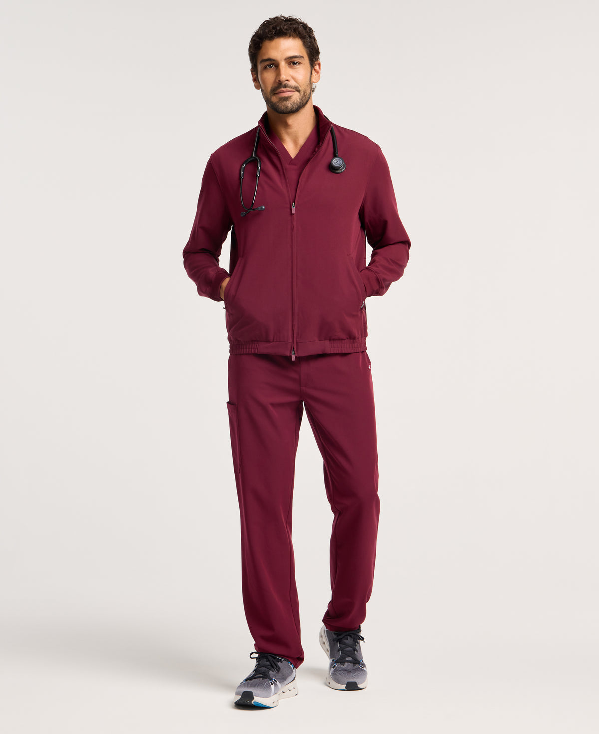 Jaanuu Wolfe 6-Pocket Scrub Jacket in Burgundy, product photo 1 of 6