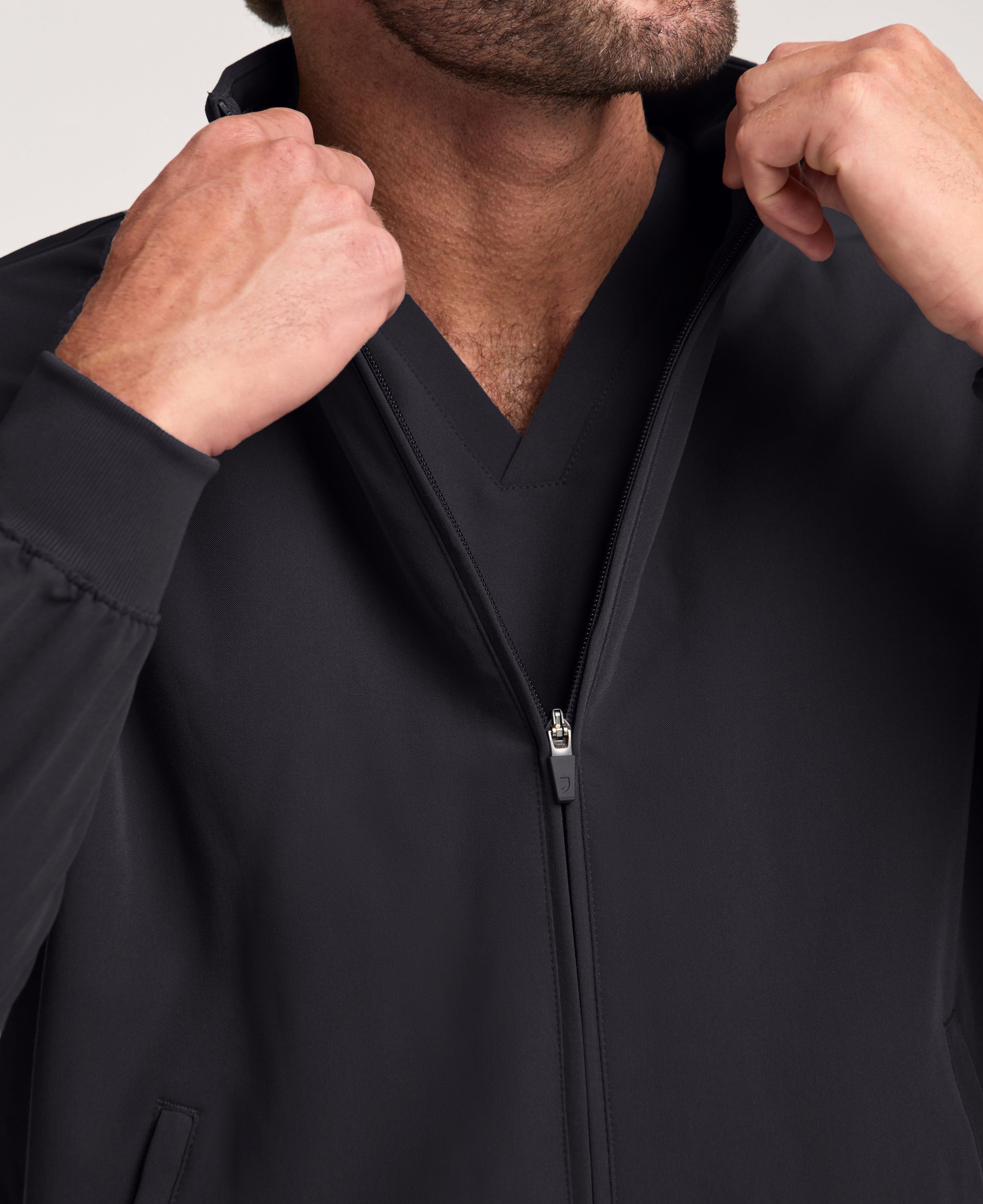 Jaanuu Wolfe 6-Pocket Scrub Jacket in Black, product photo 5 of 6