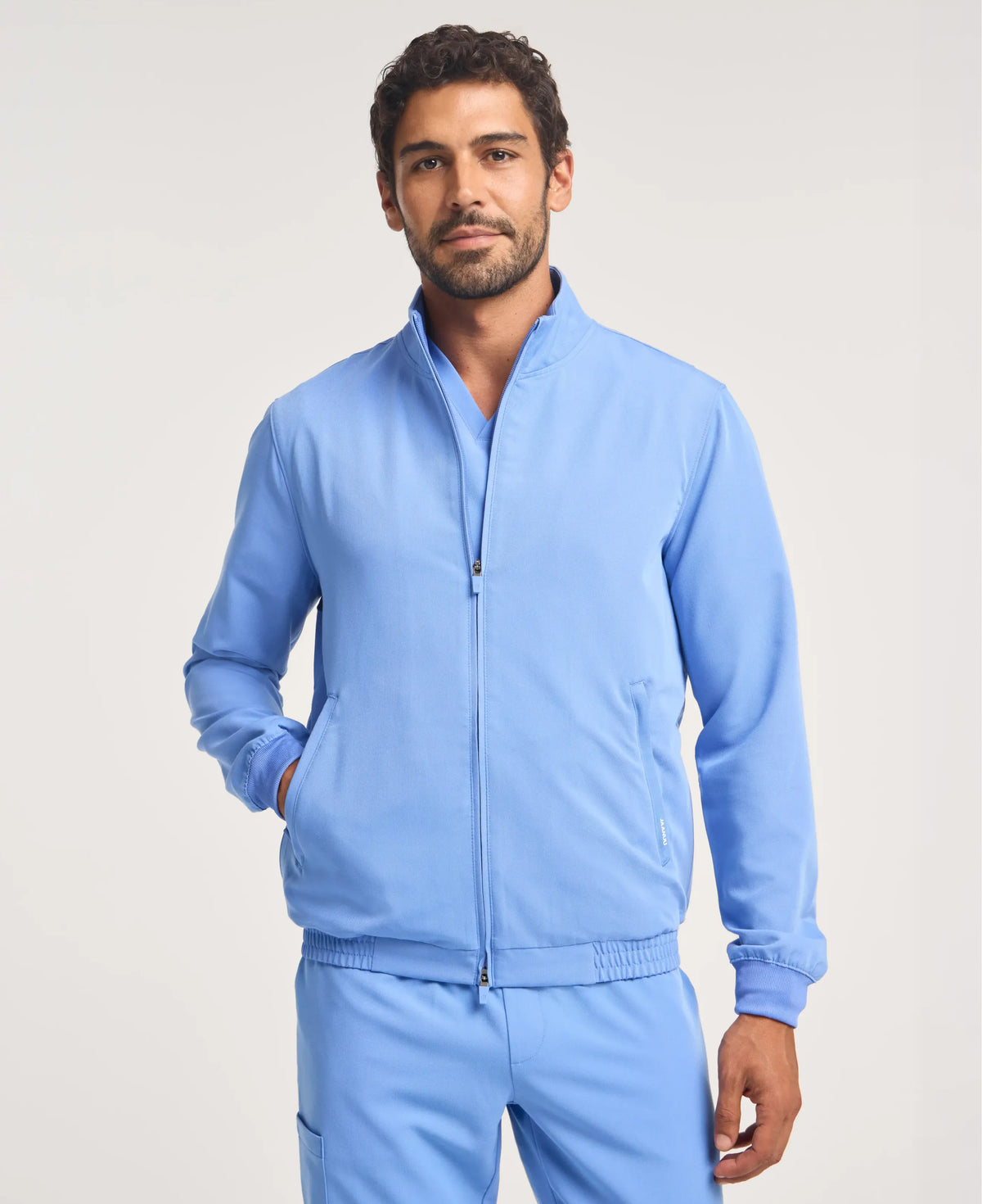 Jaanuu Wolfe 6-Pocket Scrub Jacket in Ceil Blue, product photo 1 of 6
