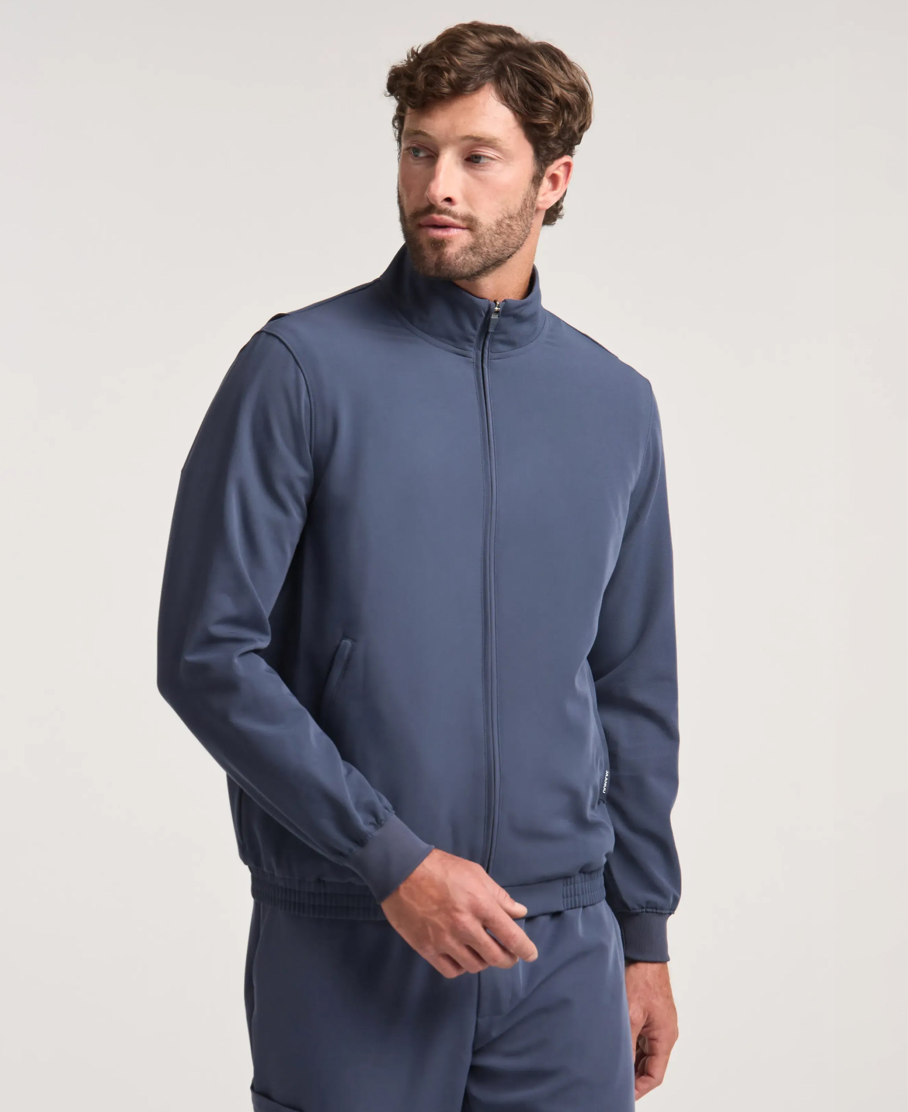 Jaanuu Wolfe 6-Pocket Scrub Jacket in Carbon Gray, product photo 1 of 6