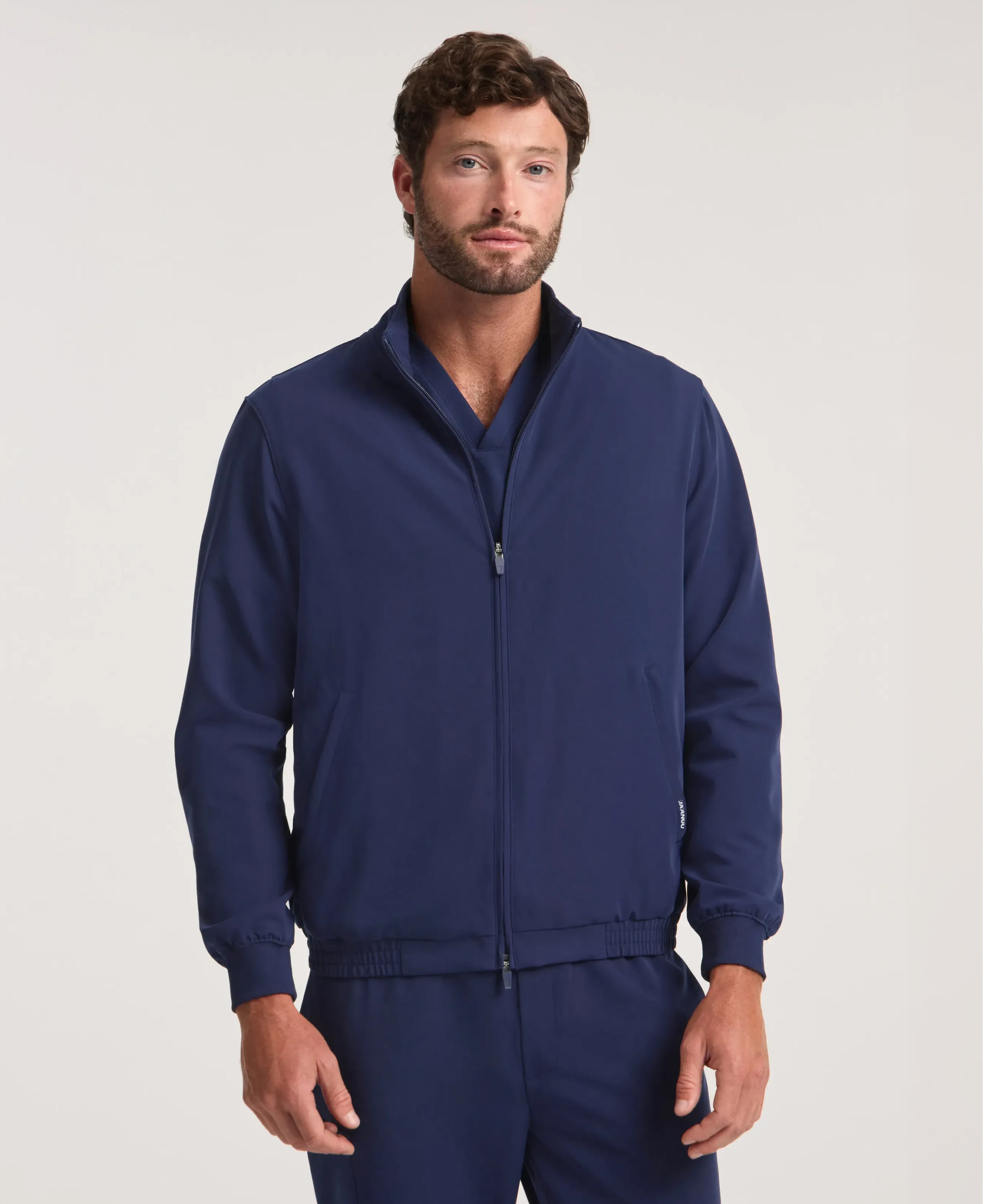 Jaanuu Wolfe 6-Pocket Scrub Jacket in Midnight Navy, product photo 1 of 6