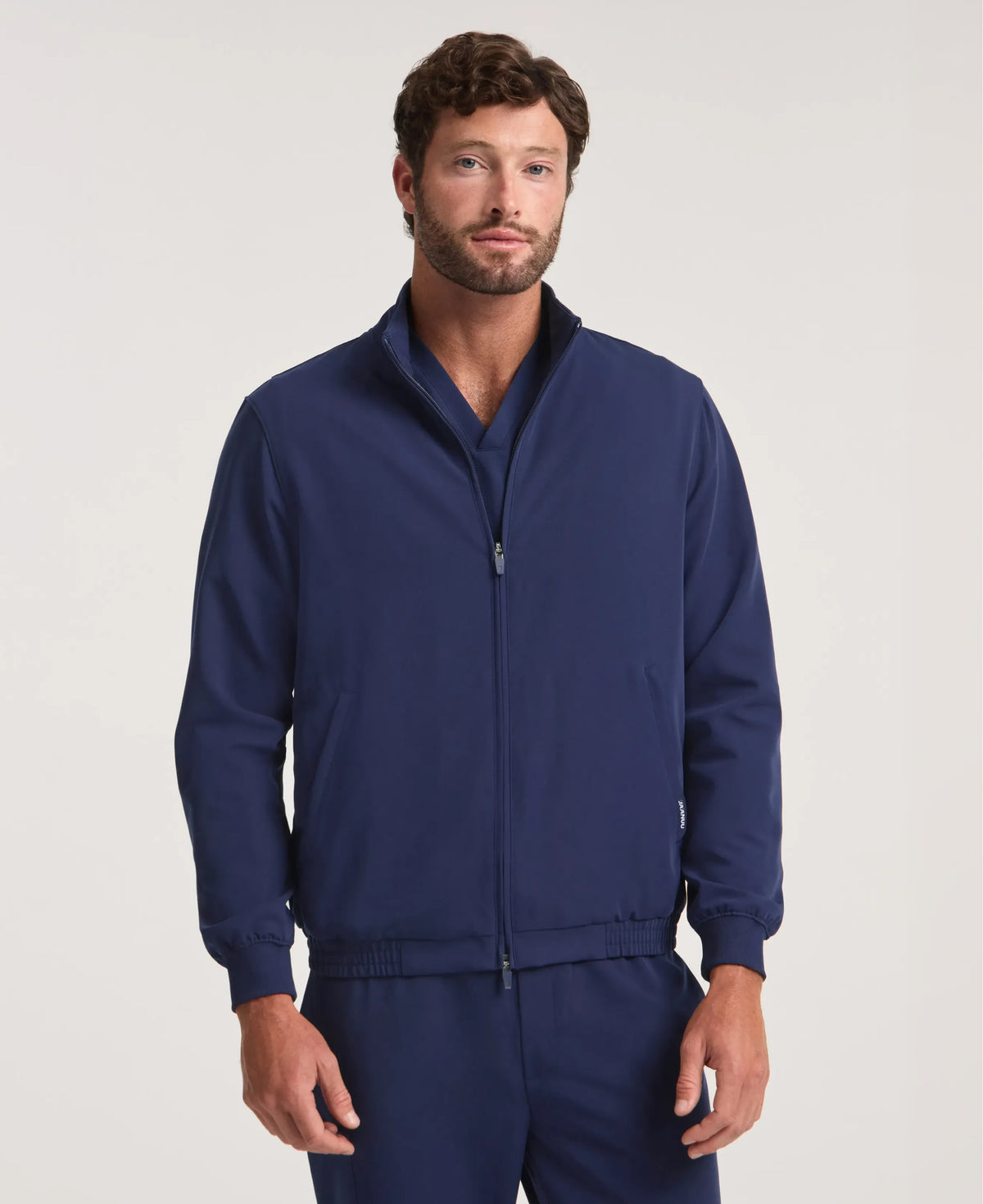 Jaanuu Wolfe 6-Pocket Scrub Jacket in Midnight Navy, product photo 1 of 6