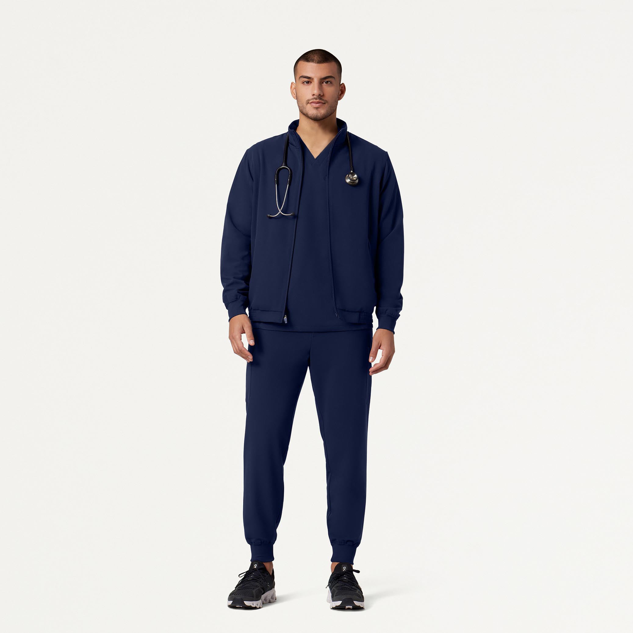 Man wearing Midnight navy scrub set with Midnight Navy scrub jacket