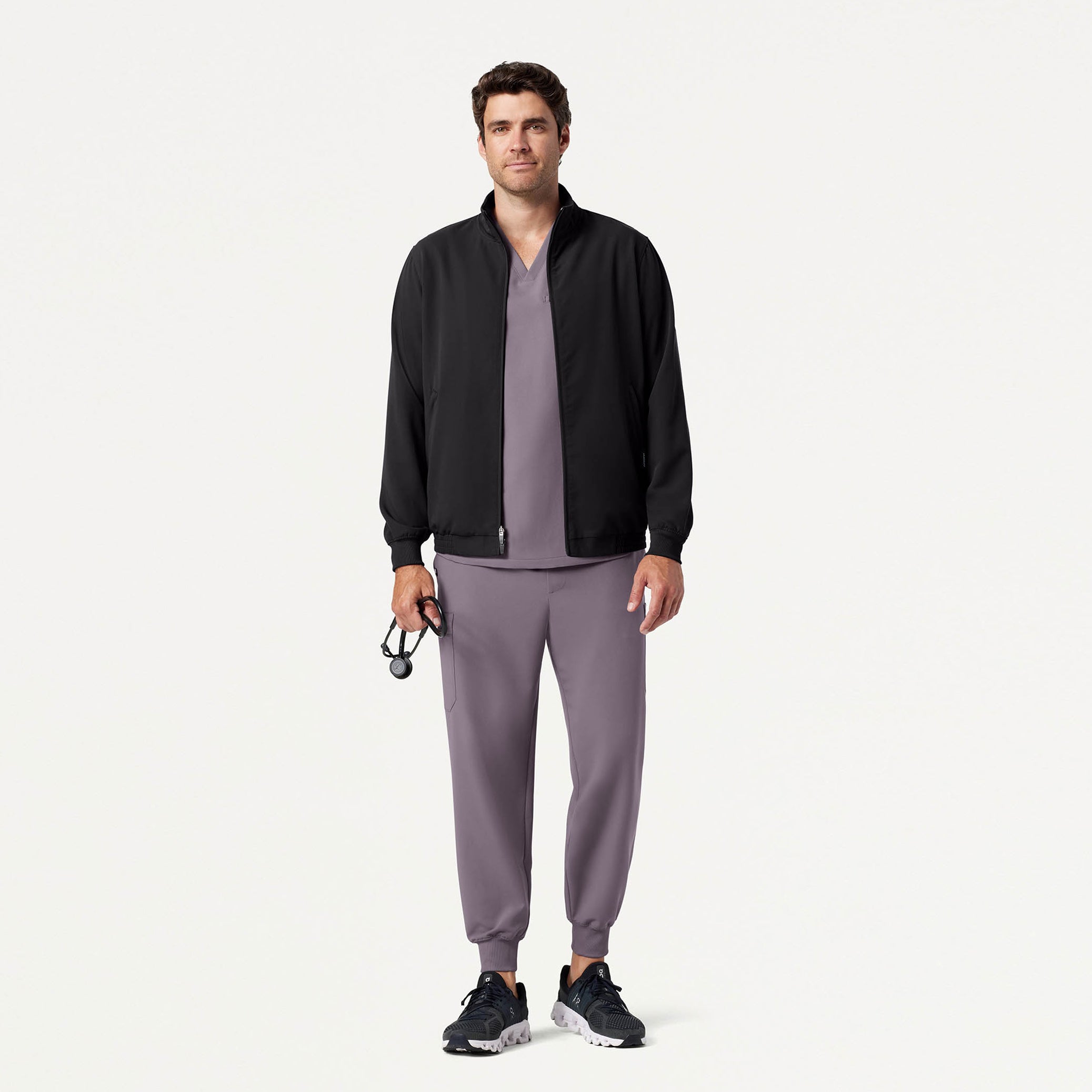 Man wearing Titanium scrub set with scrub jacket