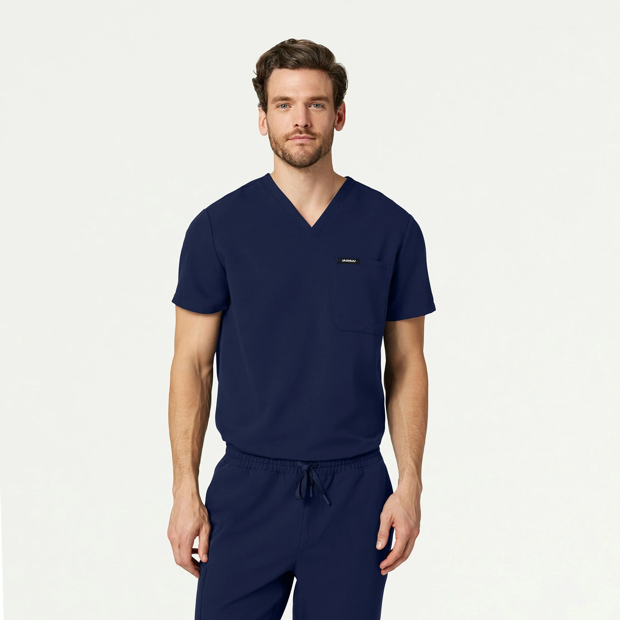 Man wearing midnight navy scrubs