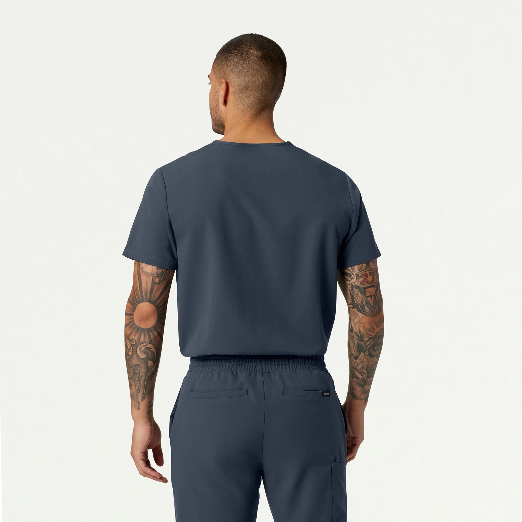 Man wearing Carbon Gray scrub top
