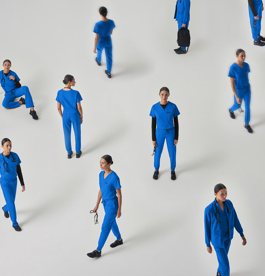 Women in scrubs doing different activities like standing, walking and sitting.