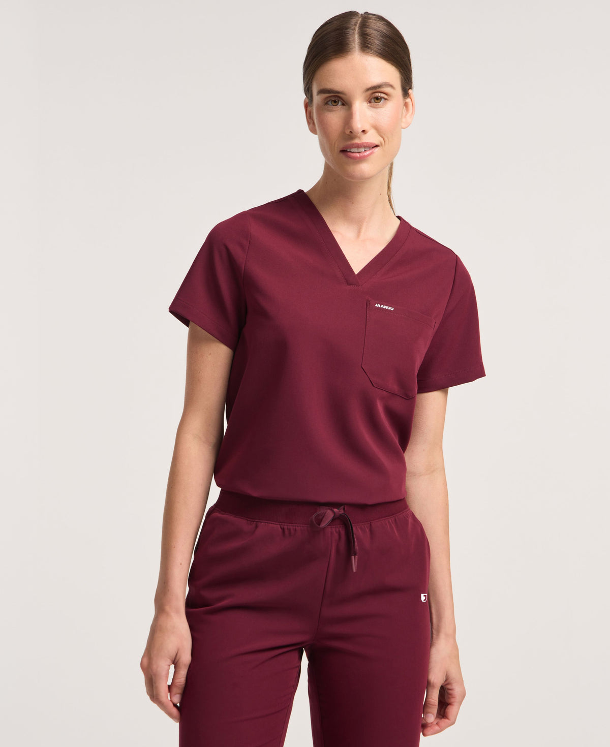 Jaanuu Rhena 1-Pocket Scrub Top in Burgundy, product photo 1 of 6
