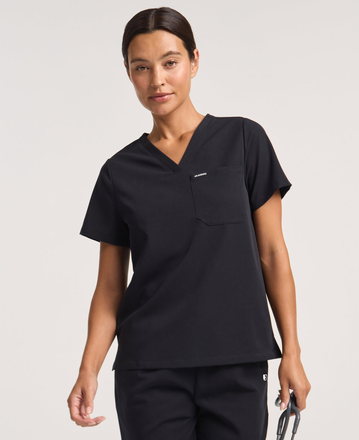 Jaanuu Rhena 1-Pocket Scrub Top in Black, product photo 1 of 6