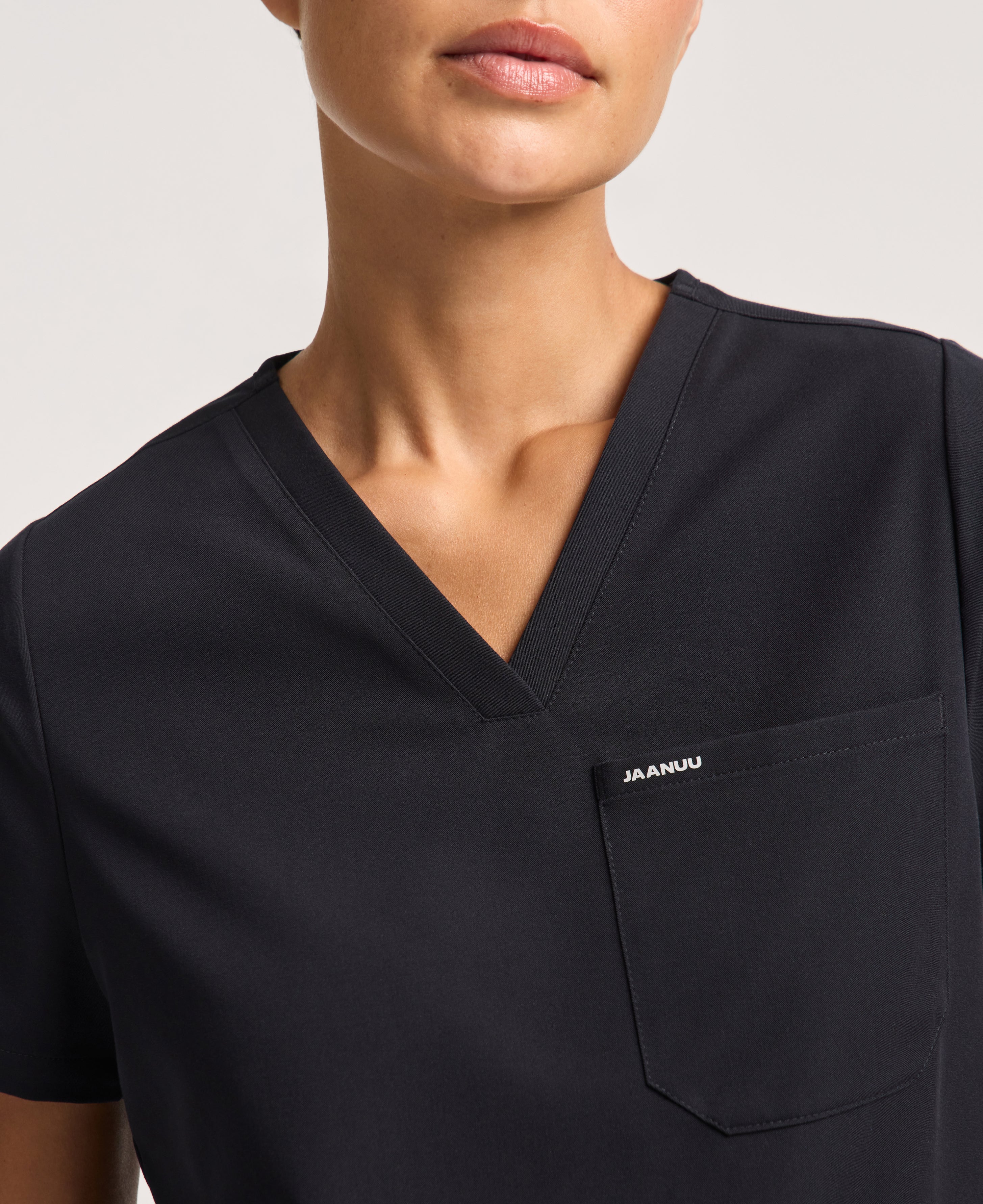 Jaanuu Rhena 1-Pocket Scrub Top in Black, product photo 4 of 6