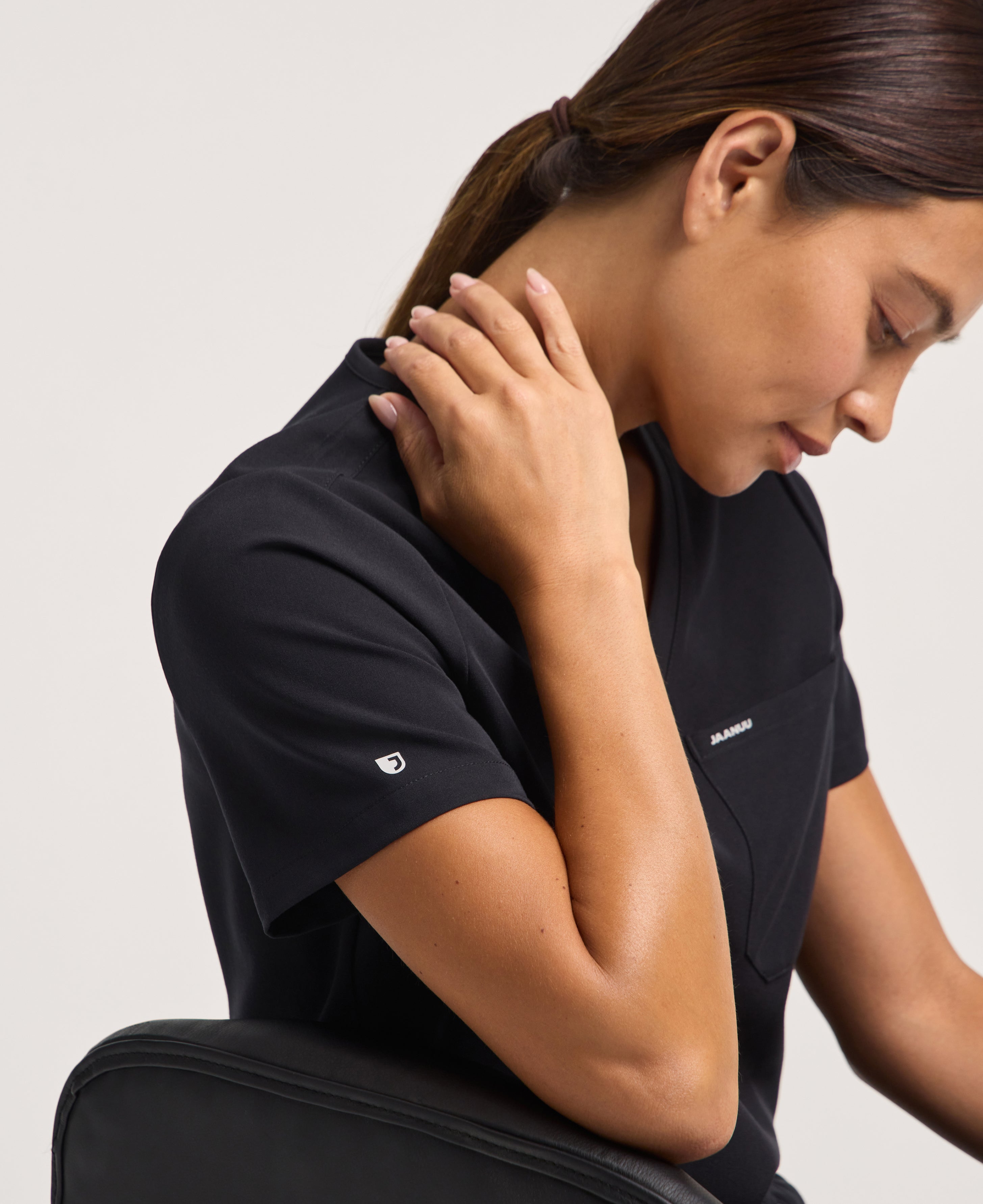 Jaanuu Rhena 1-Pocket Scrub Top in Black, product photo 5 of 6