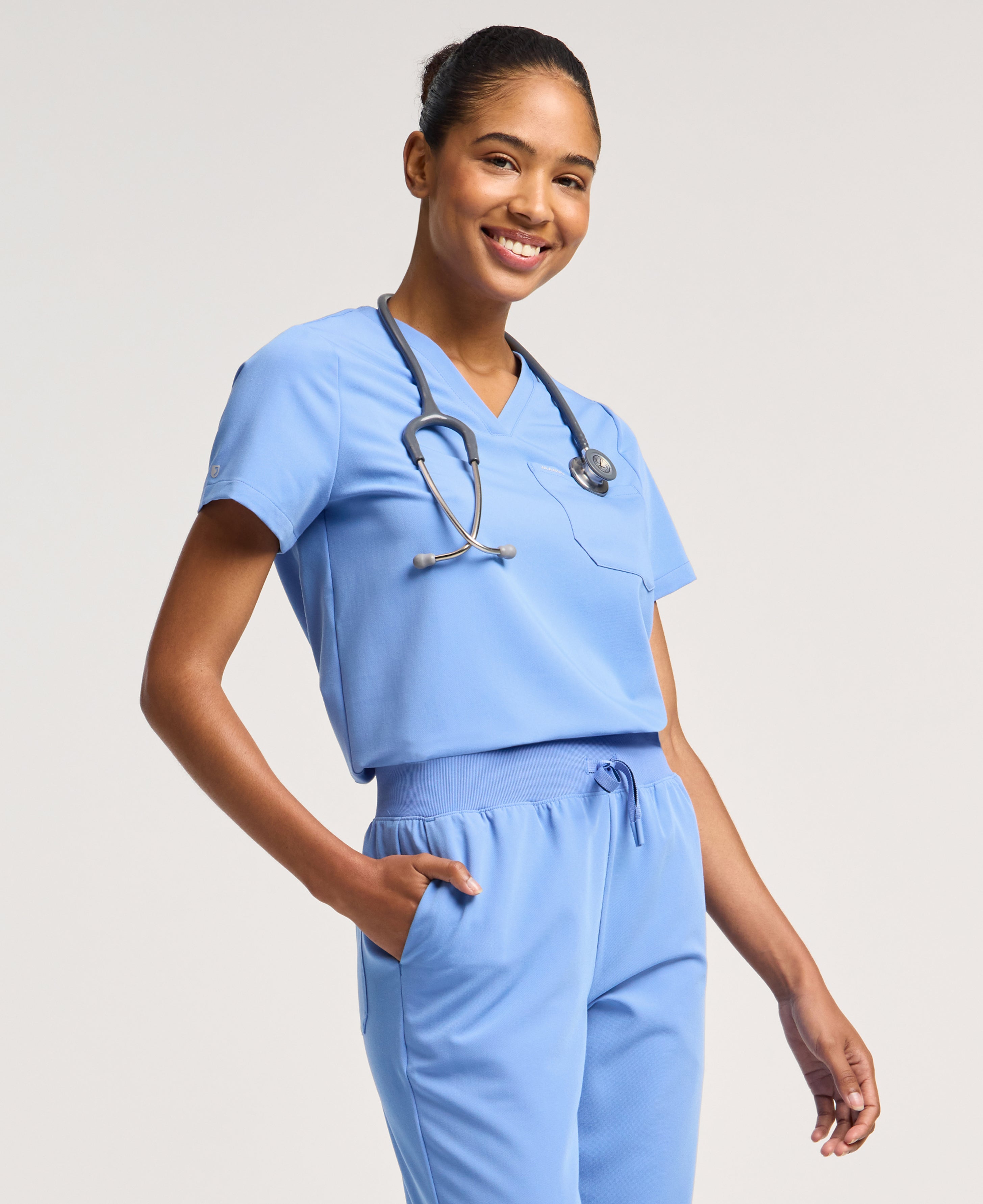 Jaanuu Rhena 1-Pocket Scrub Top in Ceil Blue, product photo 4 of 6