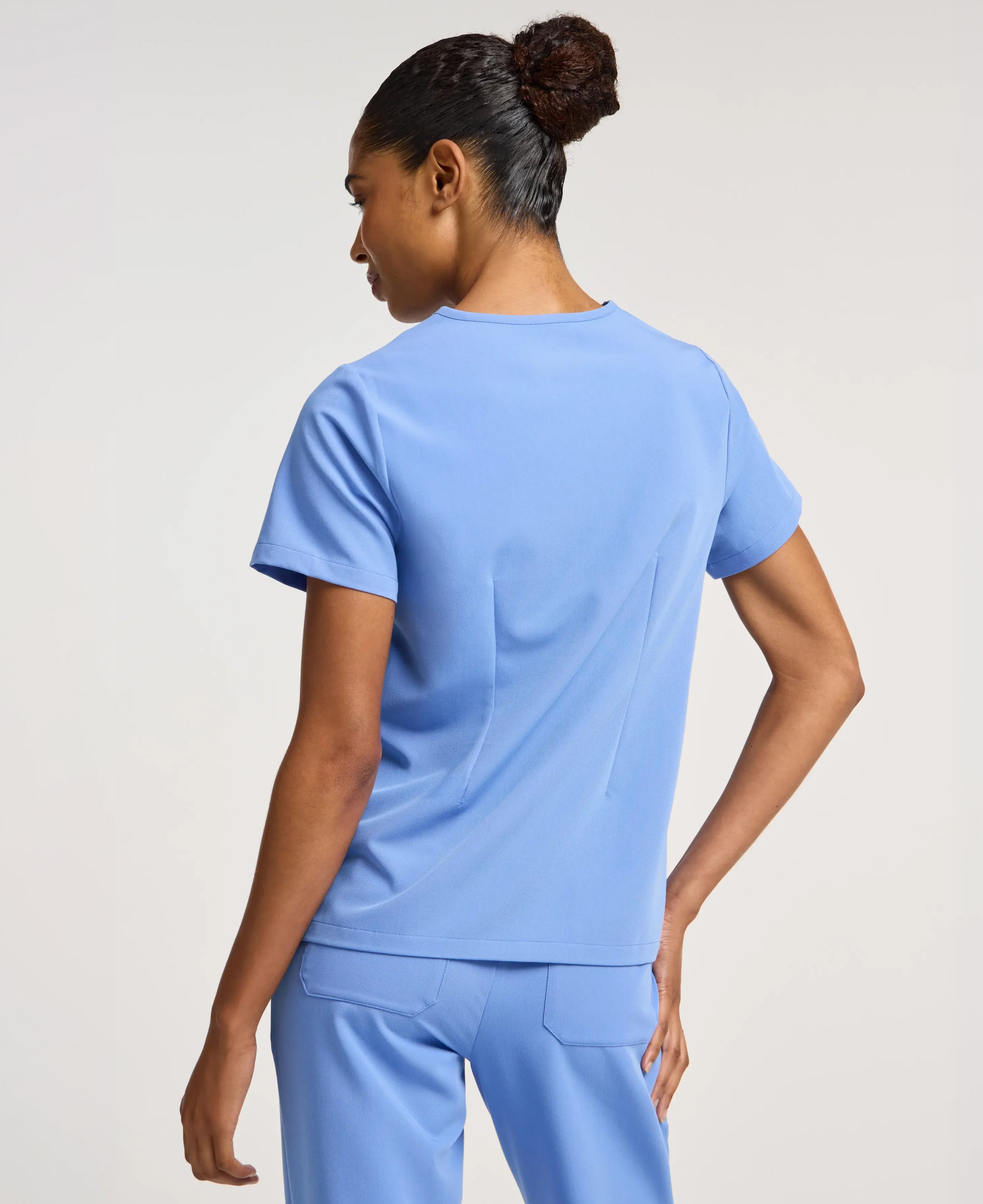 Jaanuu Rhena 1-Pocket Scrub Top in Ceil Blue, product photo 5 of 6