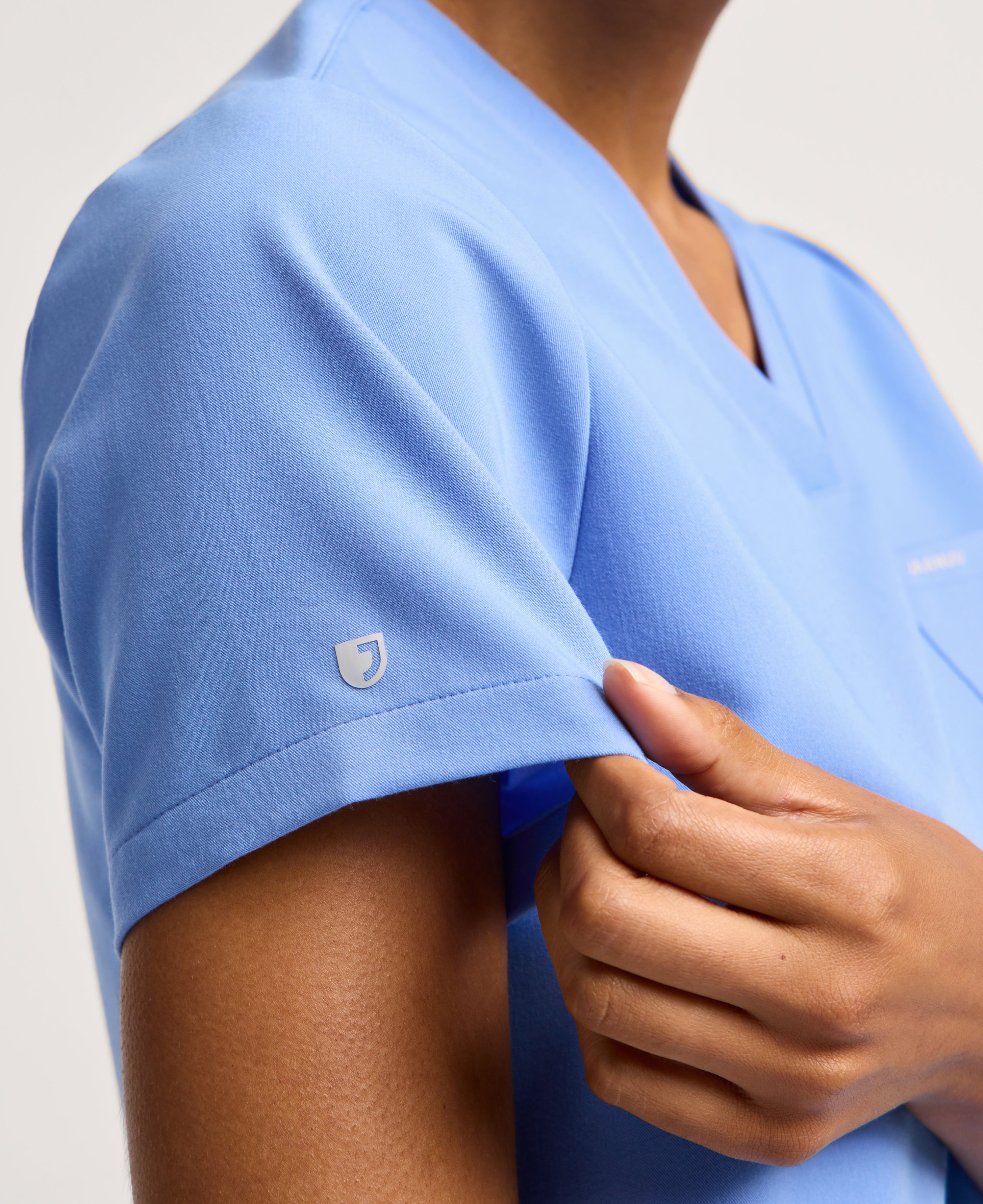 Jaanuu Rhena 1-Pocket Scrub Top in Ceil Blue, product photo 6 of 6