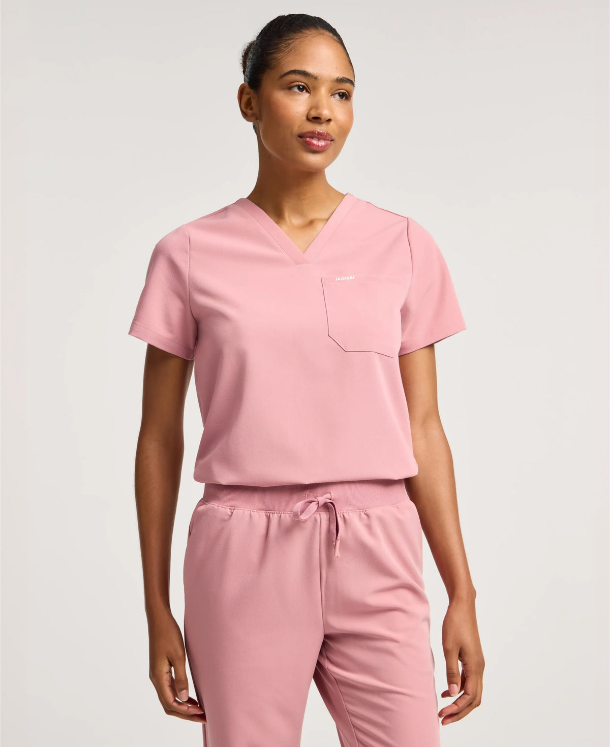 Jaanuu Rhena 1-Pocket Scrub Top in Mauve, product photo 1 of 6