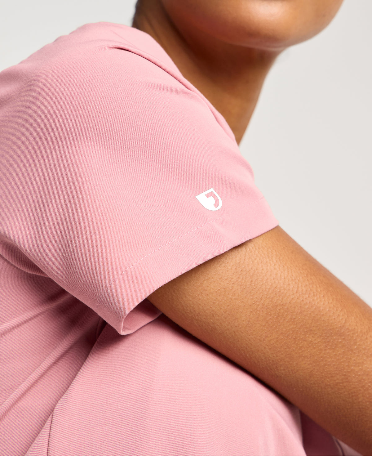 Jaanuu Rhena 1-Pocket Scrub Top in Mauve, product photo 2 of 6