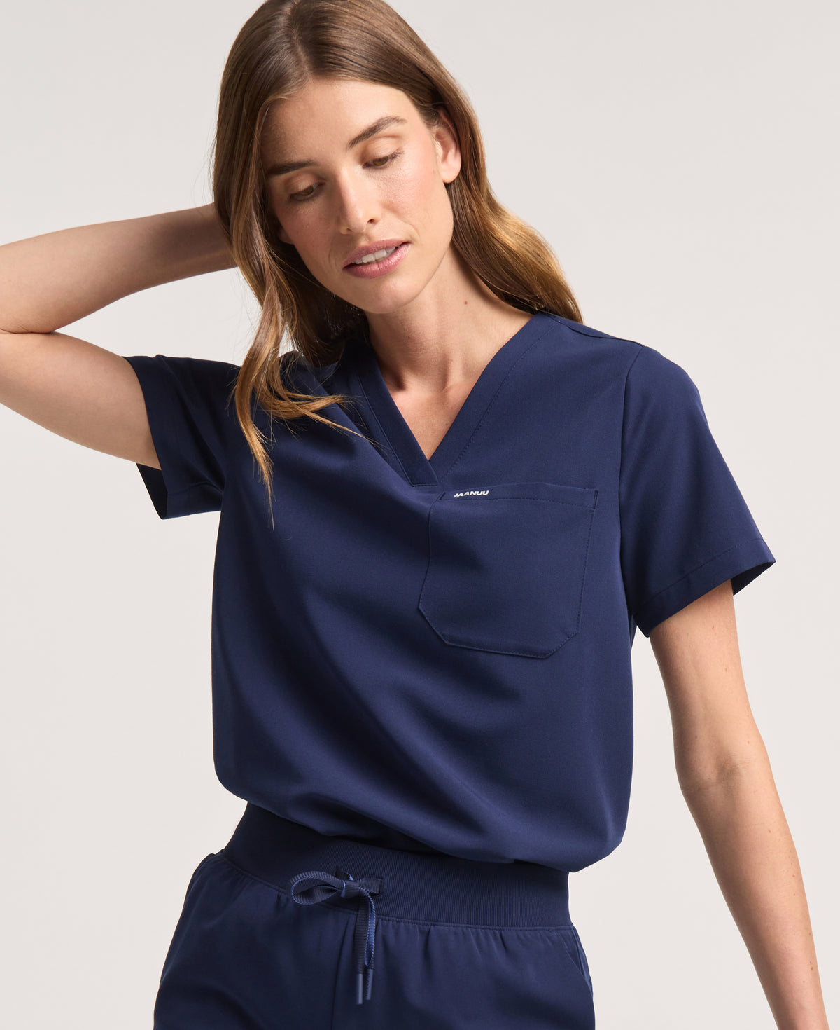 Jaanuu Rhena 1-Pocket Scrub Top in Midnight Navy, product photo 1 of 6