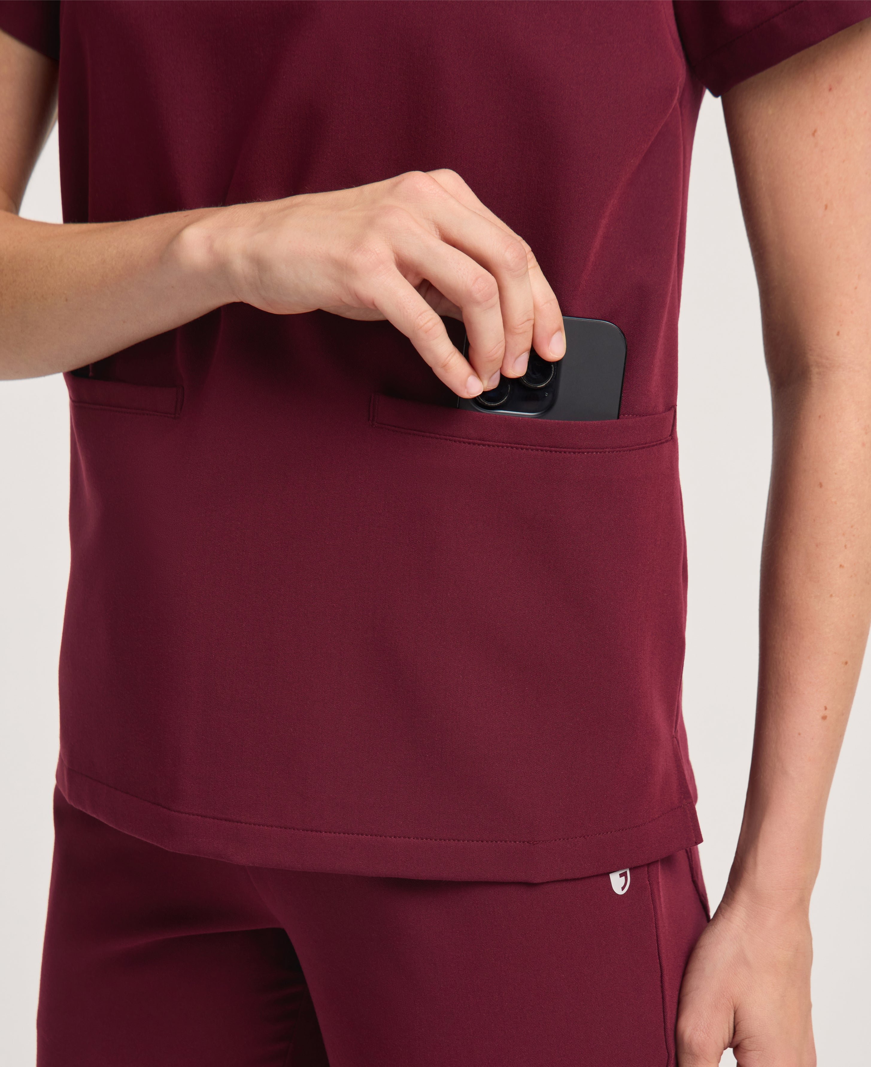 Jaanuu Helia Notched V-Neck Scrub Top in Burgundy, product photo 5 of 6