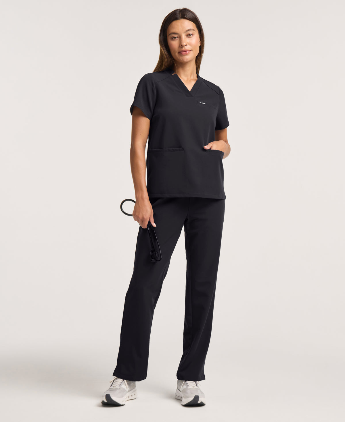 Jaanuu Helia Notched V-Neck Scrub Top in Black, product photo 3 of 6