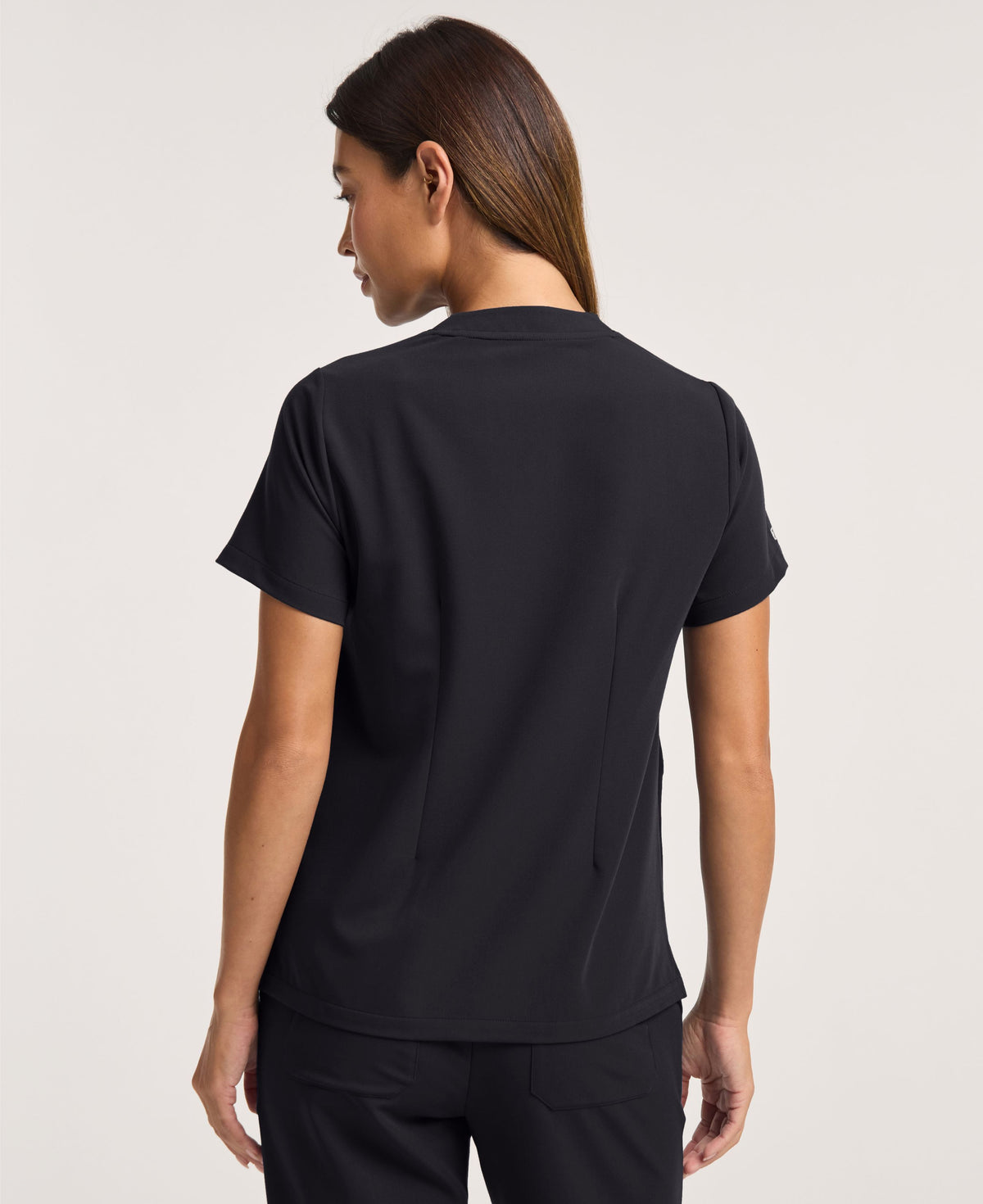Jaanuu Helia Notched V-Neck Scrub Top in Black, product photo 6 of 6