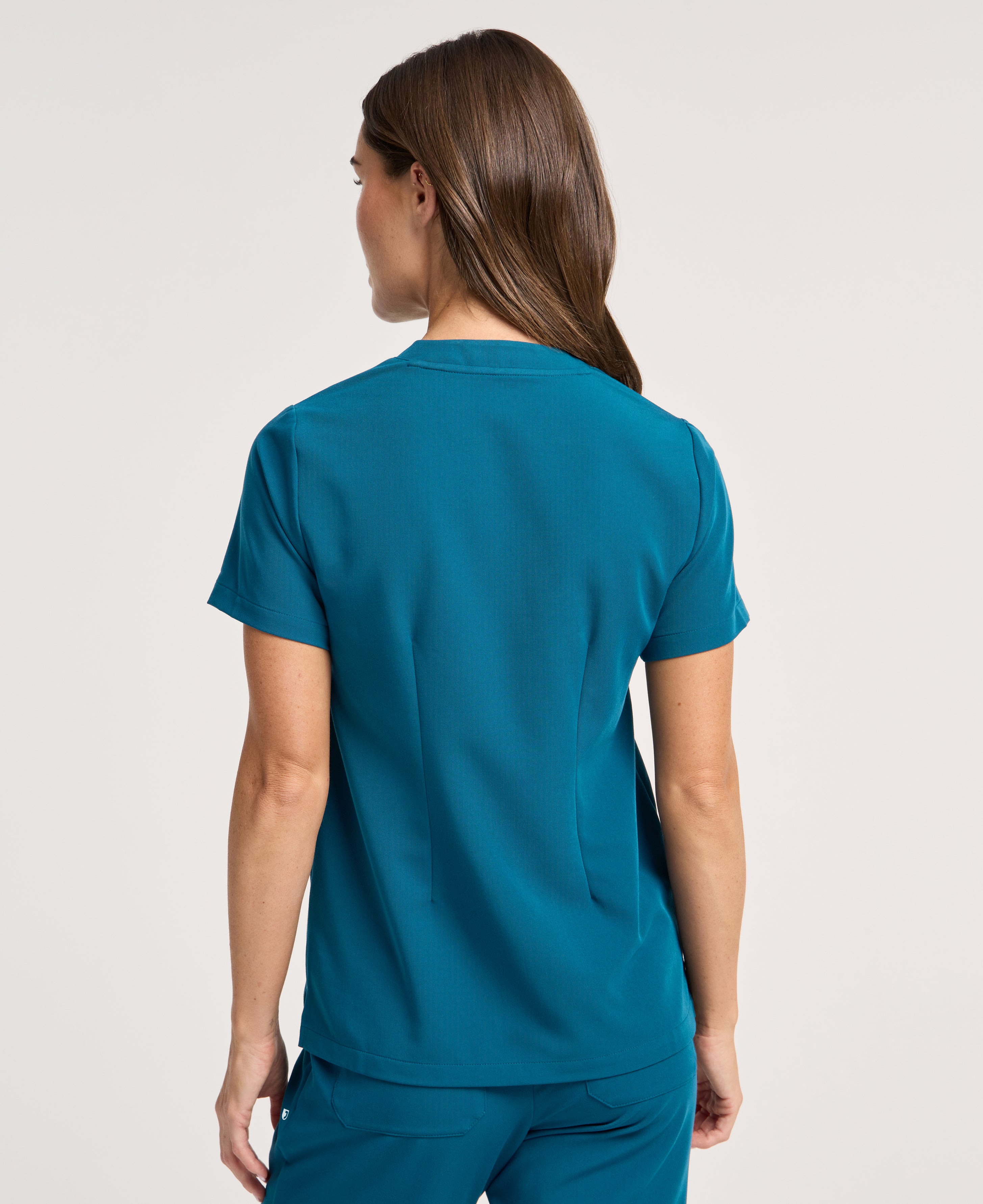 Jaanuu Helia Notched V-Neck Scrub Top in Caribbean Blue, product photo 5 of 6