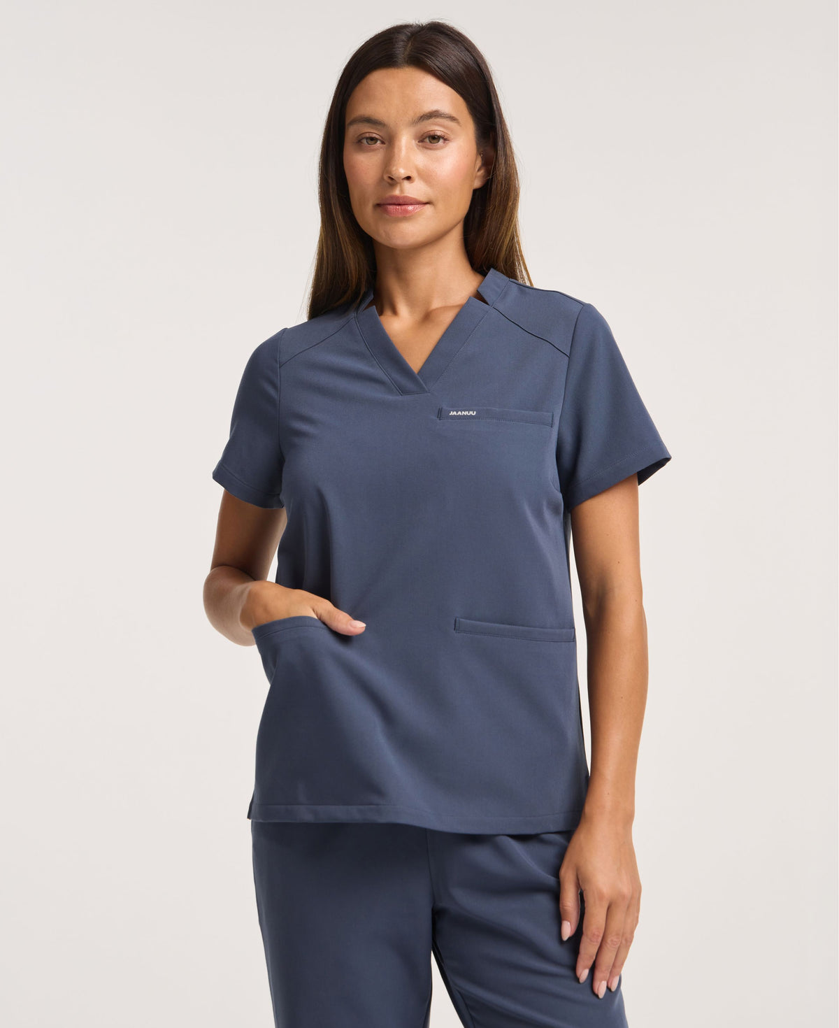 Jaanuu Helia Notched V-Neck Scrub Top in Carbon Gray, product photo 1 of 6