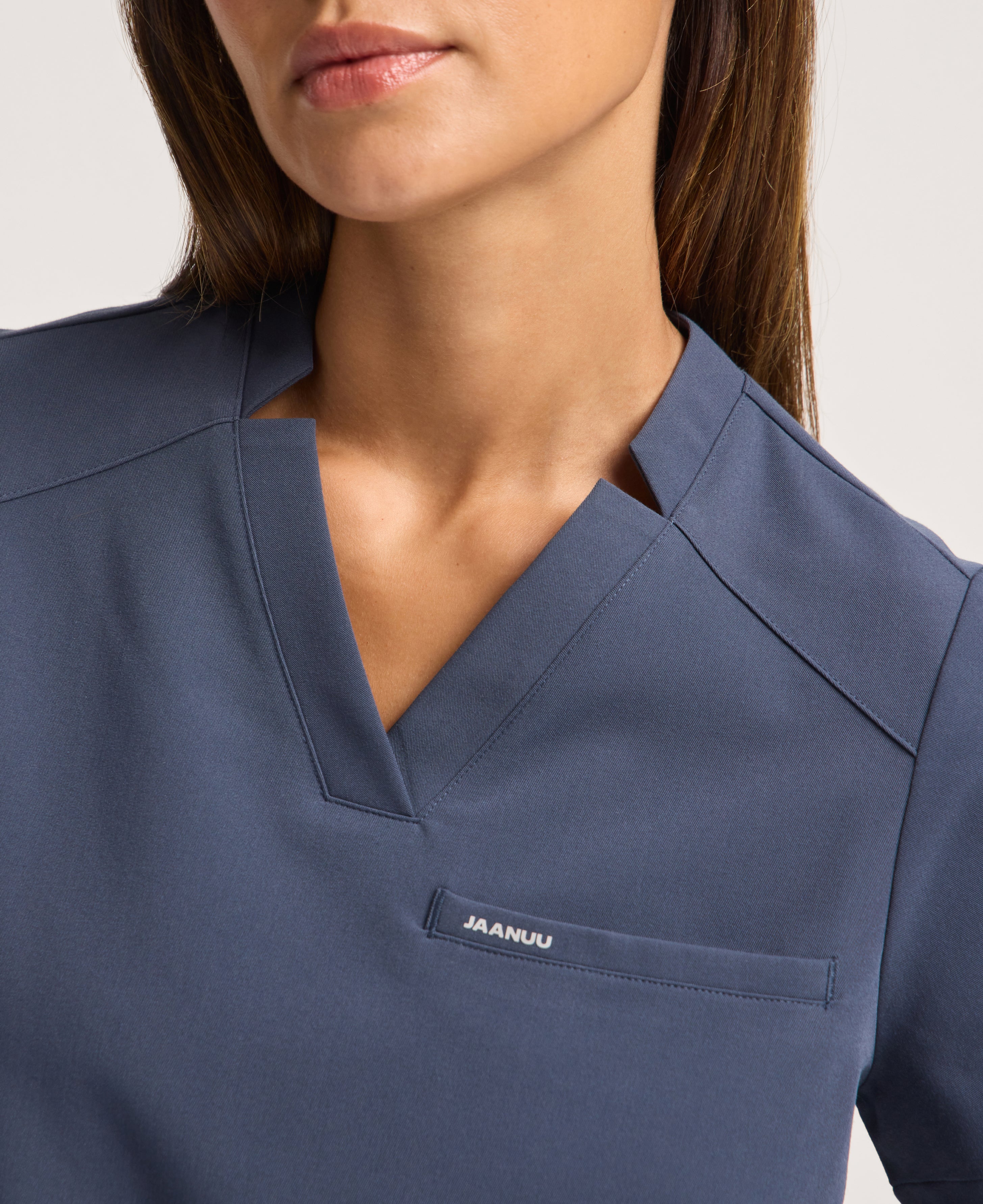 Jaanuu Helia Notched V-Neck Scrub Top in Carbon Gray, product photo 4 of 6