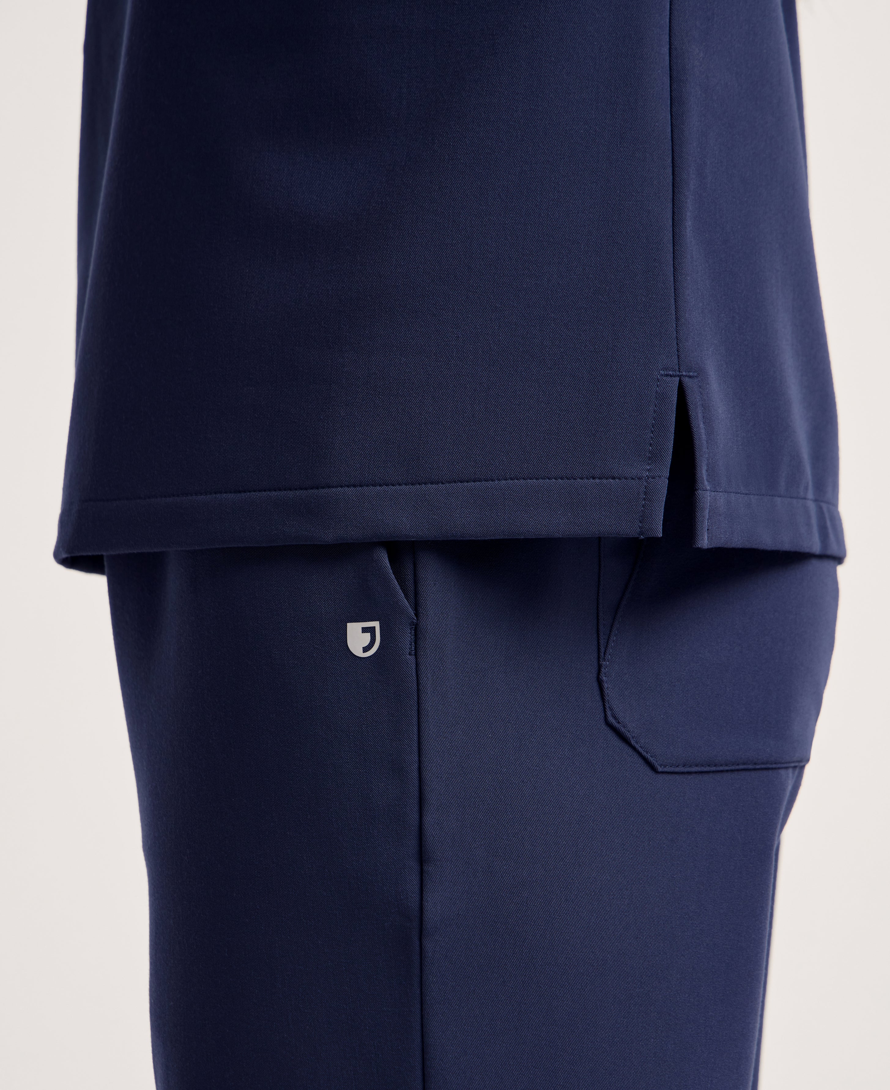 Jaanuu Helia Notched V-Neck Scrub Top in Midnight Navy, product photo 6 of 6