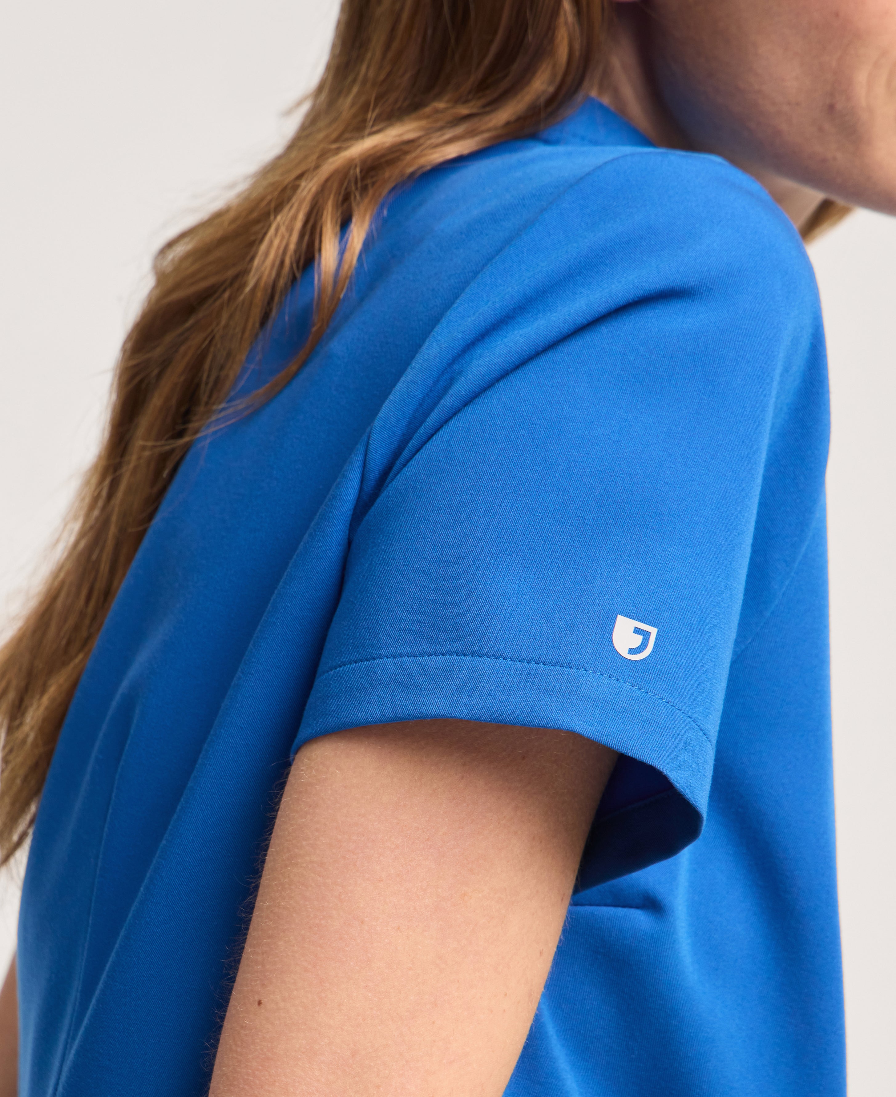 Jaanuu Helia Notched V-Neck Scrub Top in Royal Blue, product photo 3 of 6