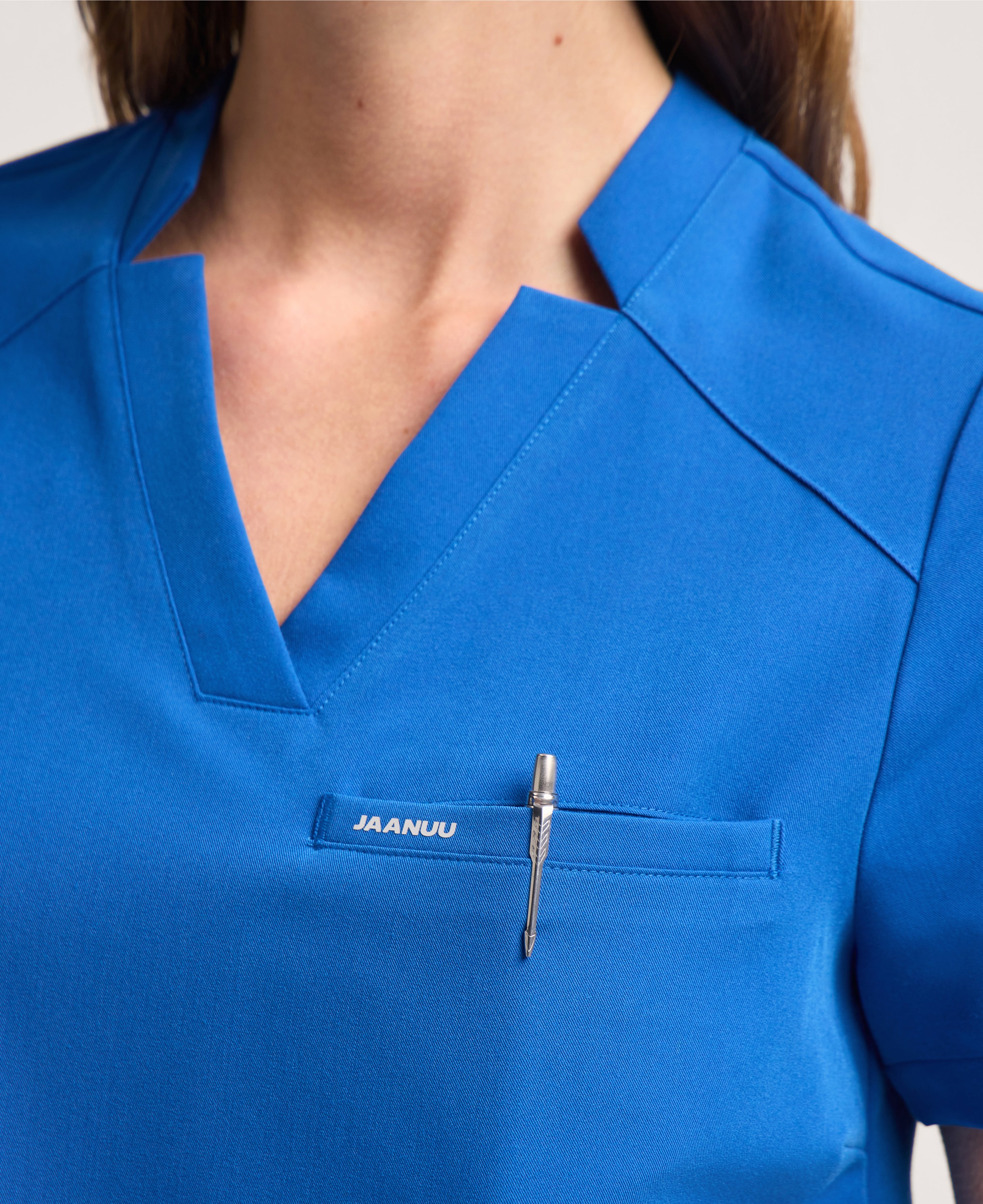 Jaanuu Helia Notched V-Neck Scrub Top in Royal Blue, product photo 4 of 6