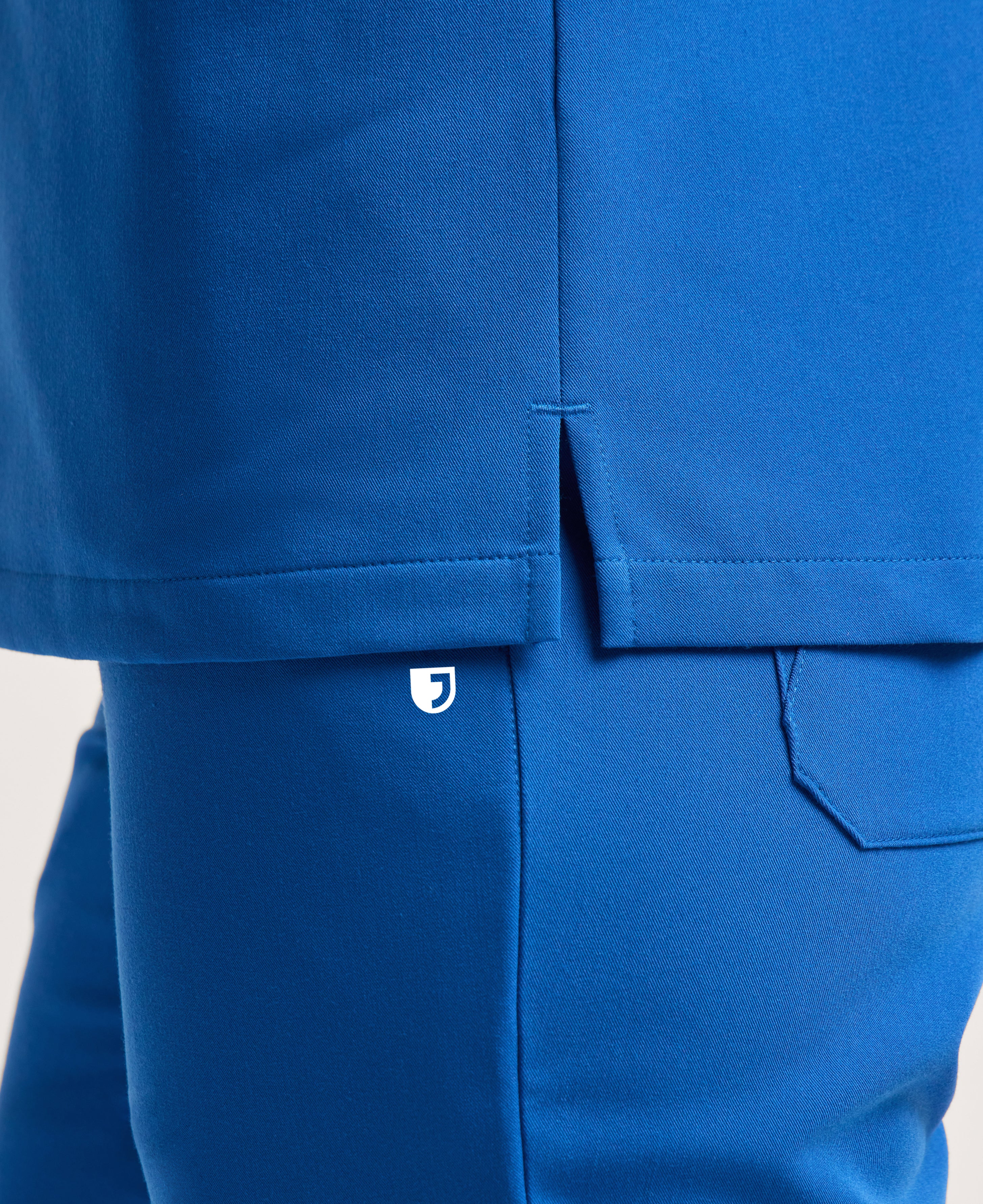 Jaanuu Helia Notched V-Neck Scrub Top in Royal Blue, product photo 5 of 6