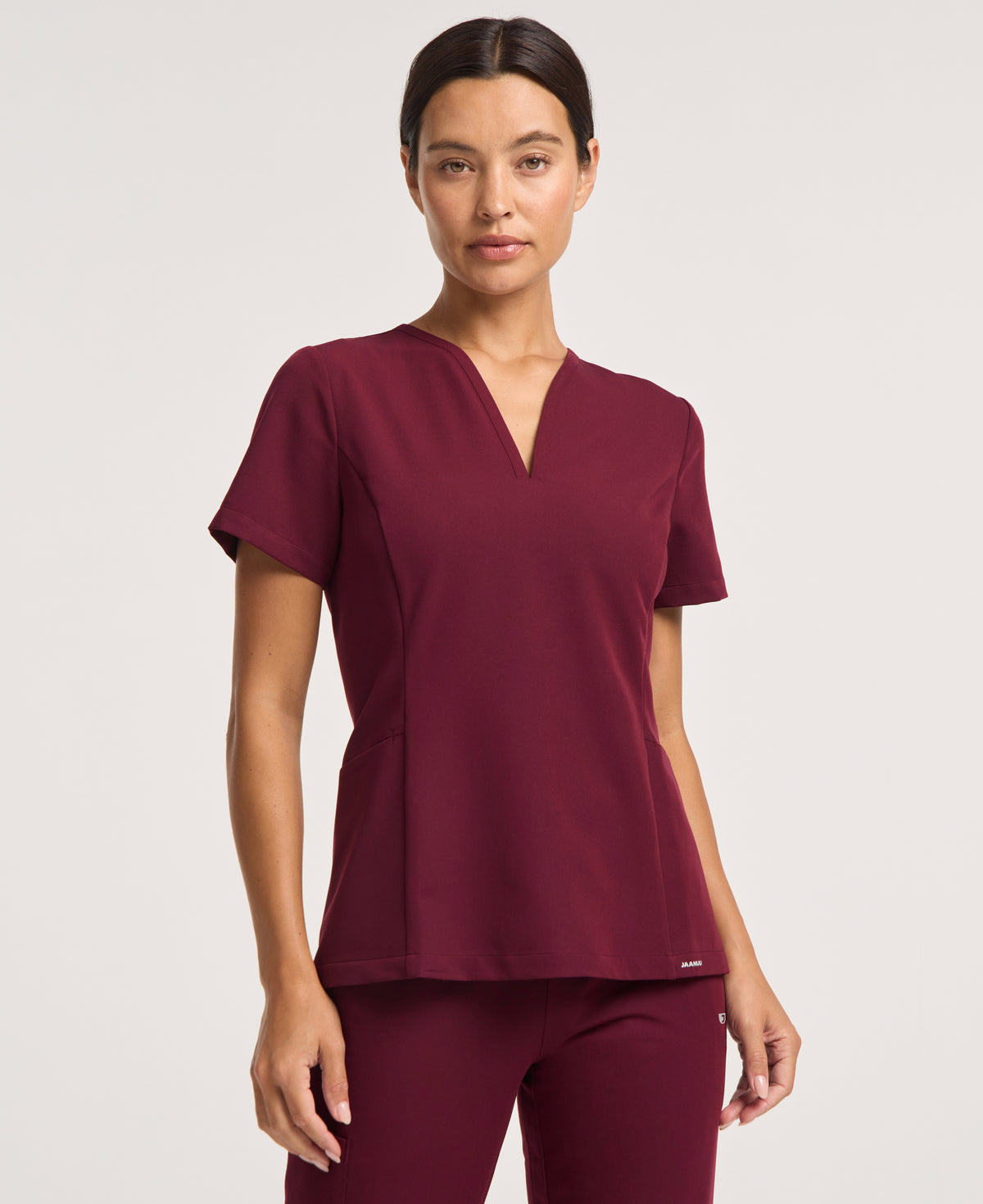 Jaanuu Calix Fit & Flare Scrub Top in Burgundy, product photo 2 of 6
