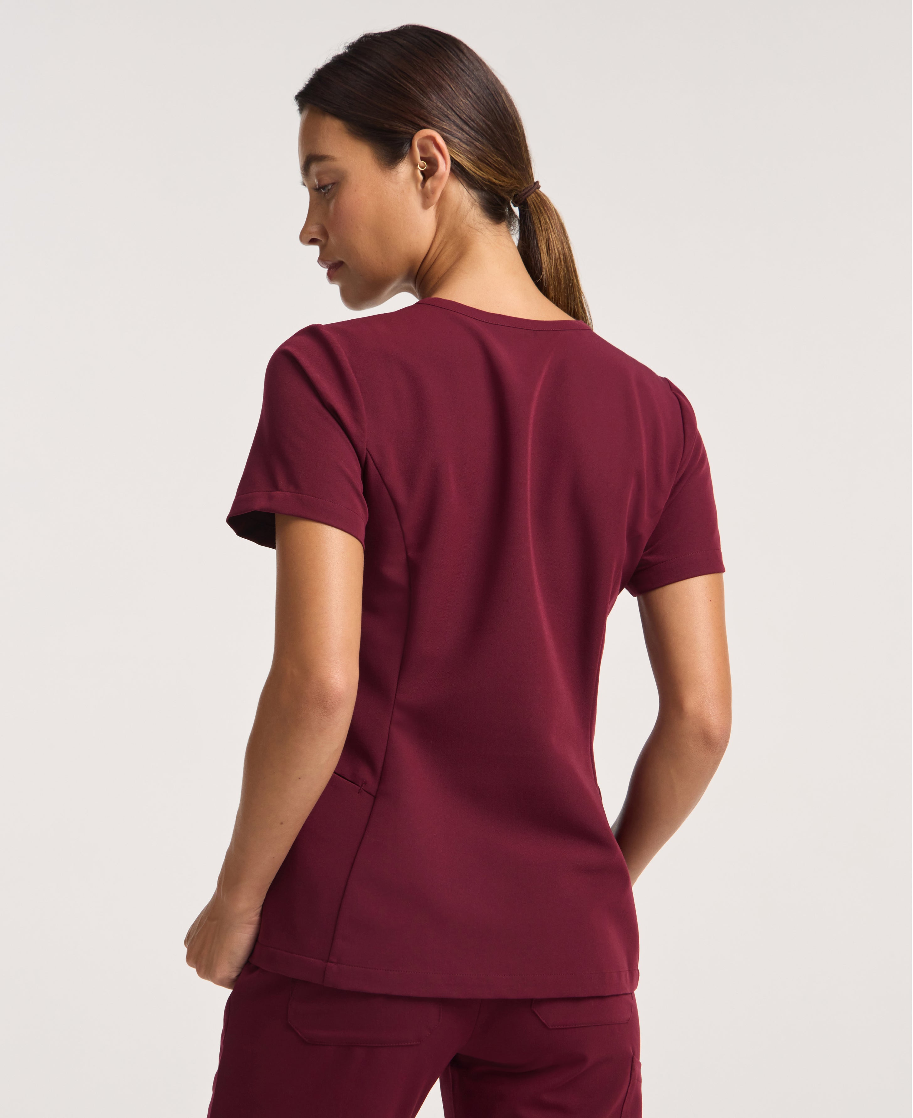 Jaanuu Calix Fit & Flare Scrub Top in Burgundy, product photo 6 of 6