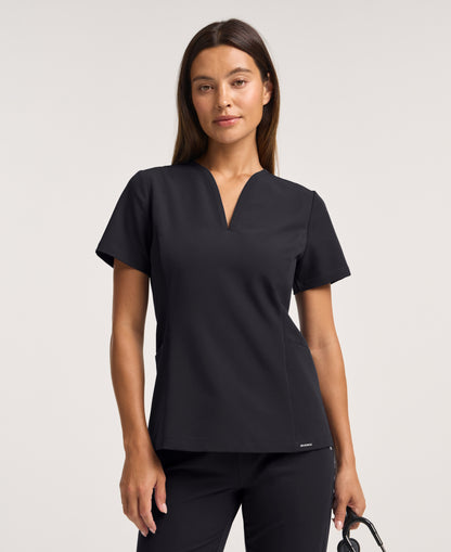 Jaanuu Calix Fit & Flare Scrub Top in Black, product photo 1 of 6