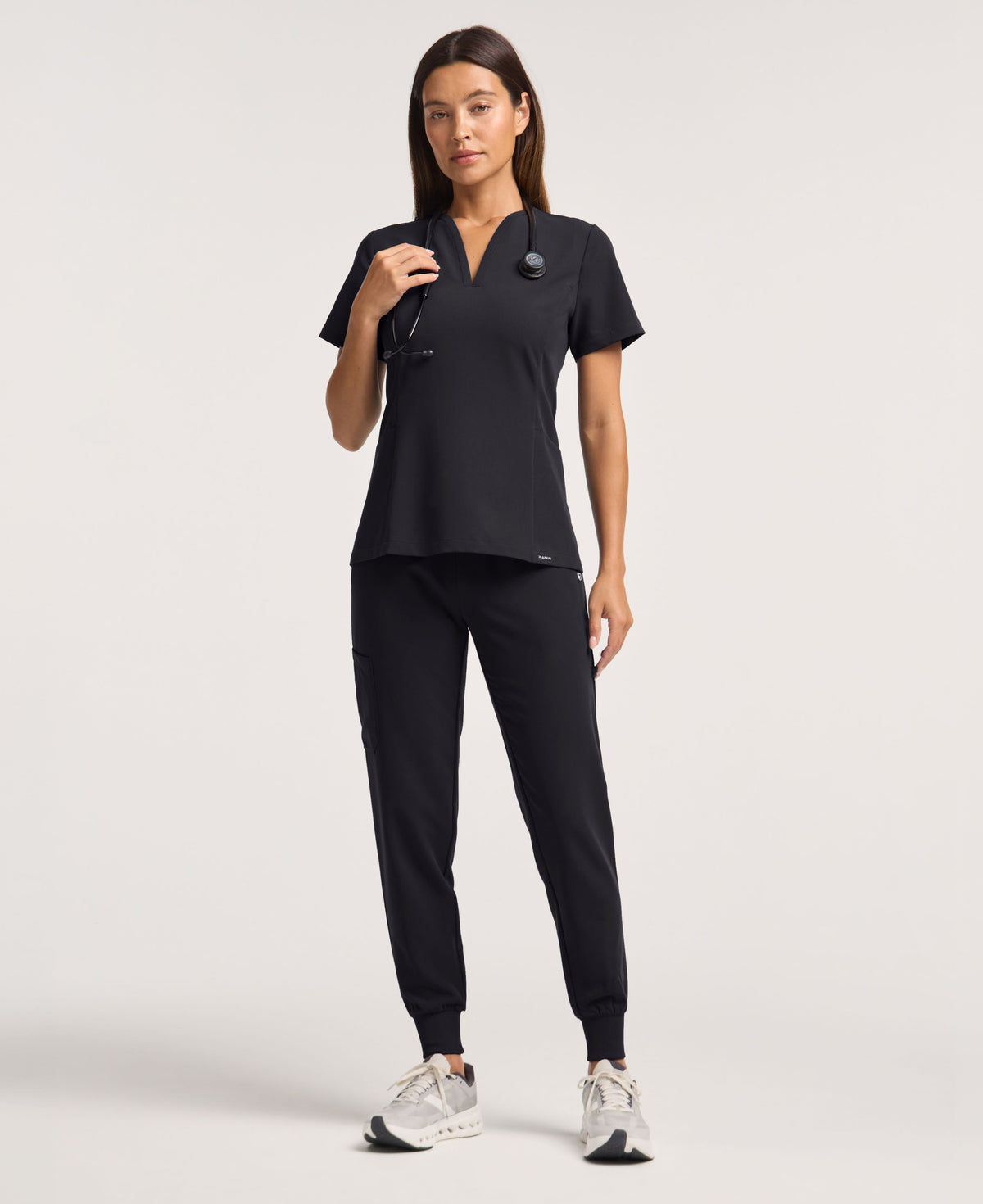 Jaanuu Calix Fit & Flare Scrub Top in Black, product photo 4 of 6