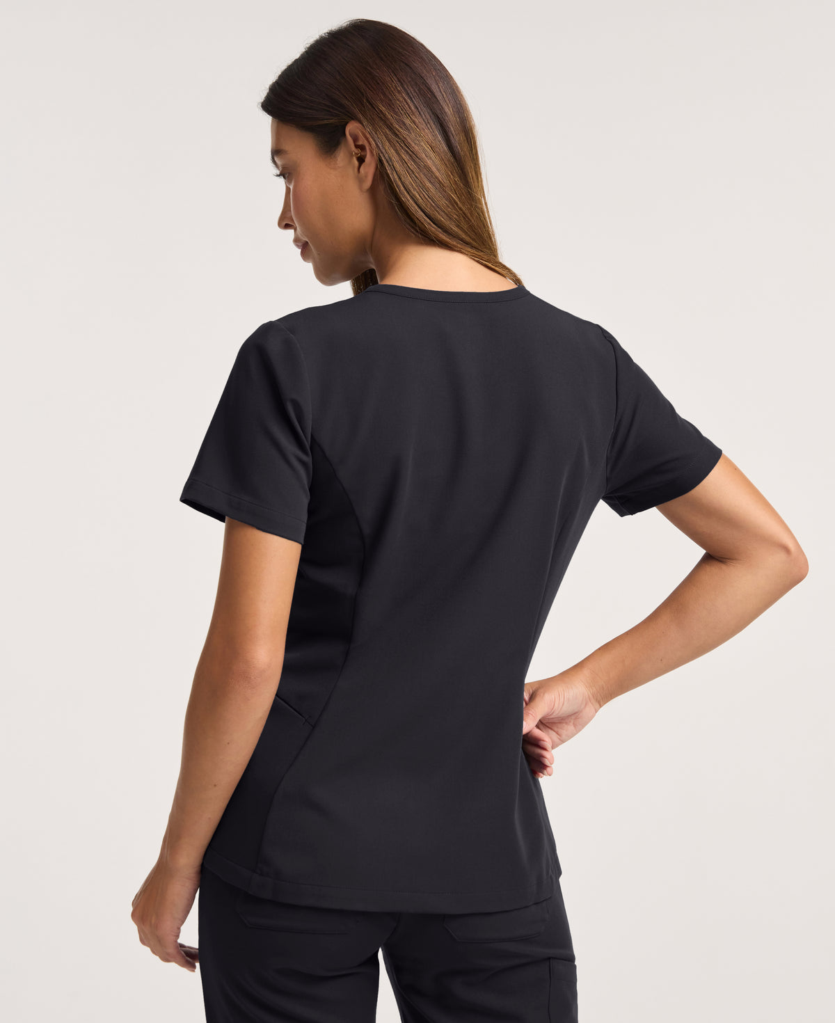 Jaanuu Calix Fit & Flare Scrub Top in Black, product photo 5 of 6