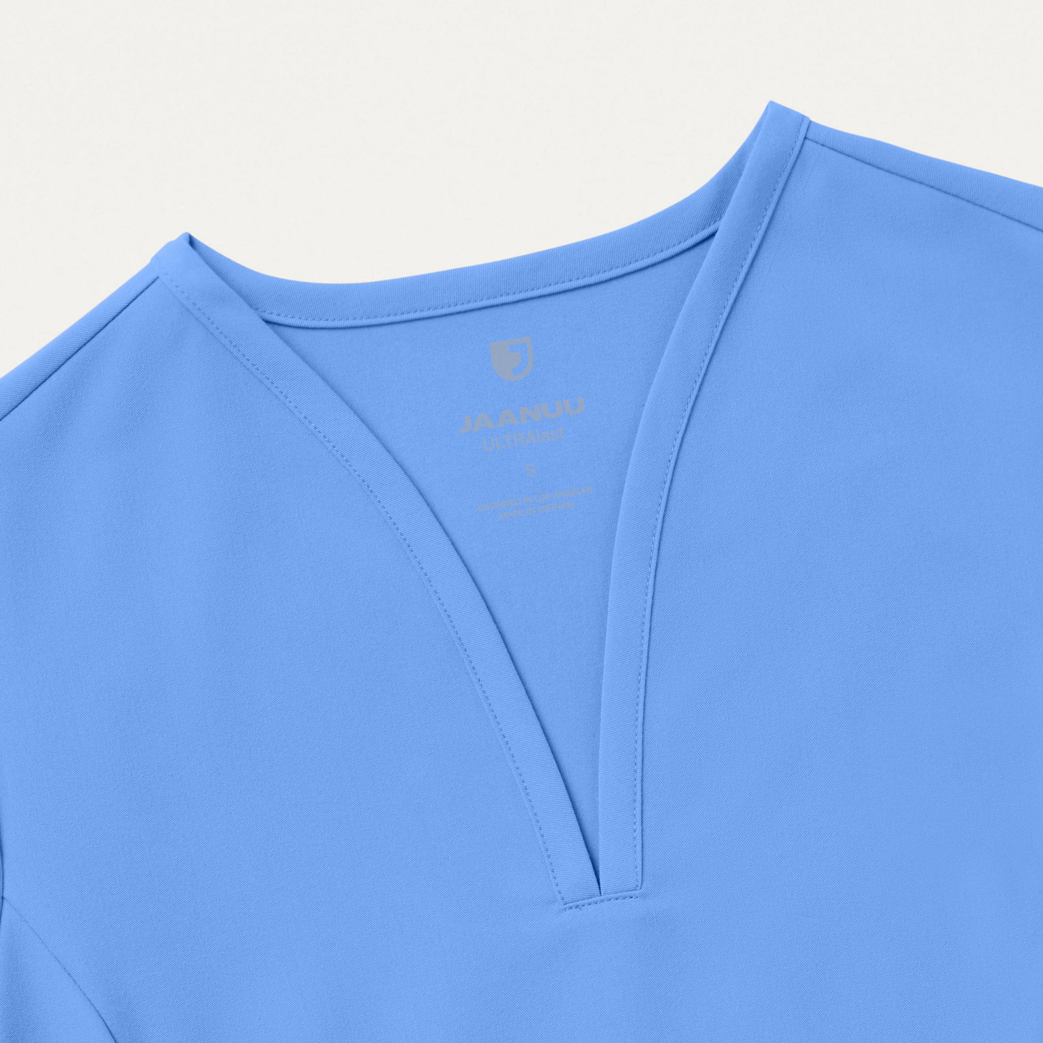 【YOURNUS】Silent Blue Half Sleeve Calix Fit & Flare Scrub Top - Ceil Blue – Jaanuu