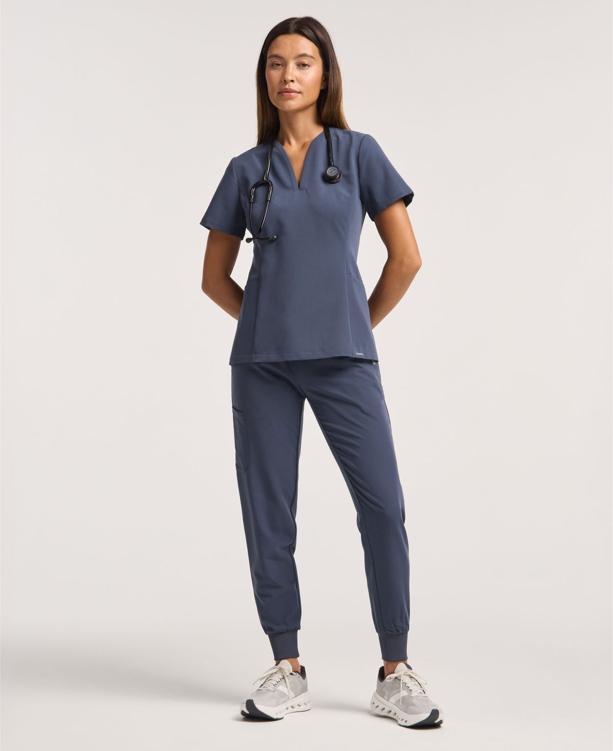 Jaanuu Calix Fit & Flare Scrub Top in Carbon Gray, product photo 1 of 6